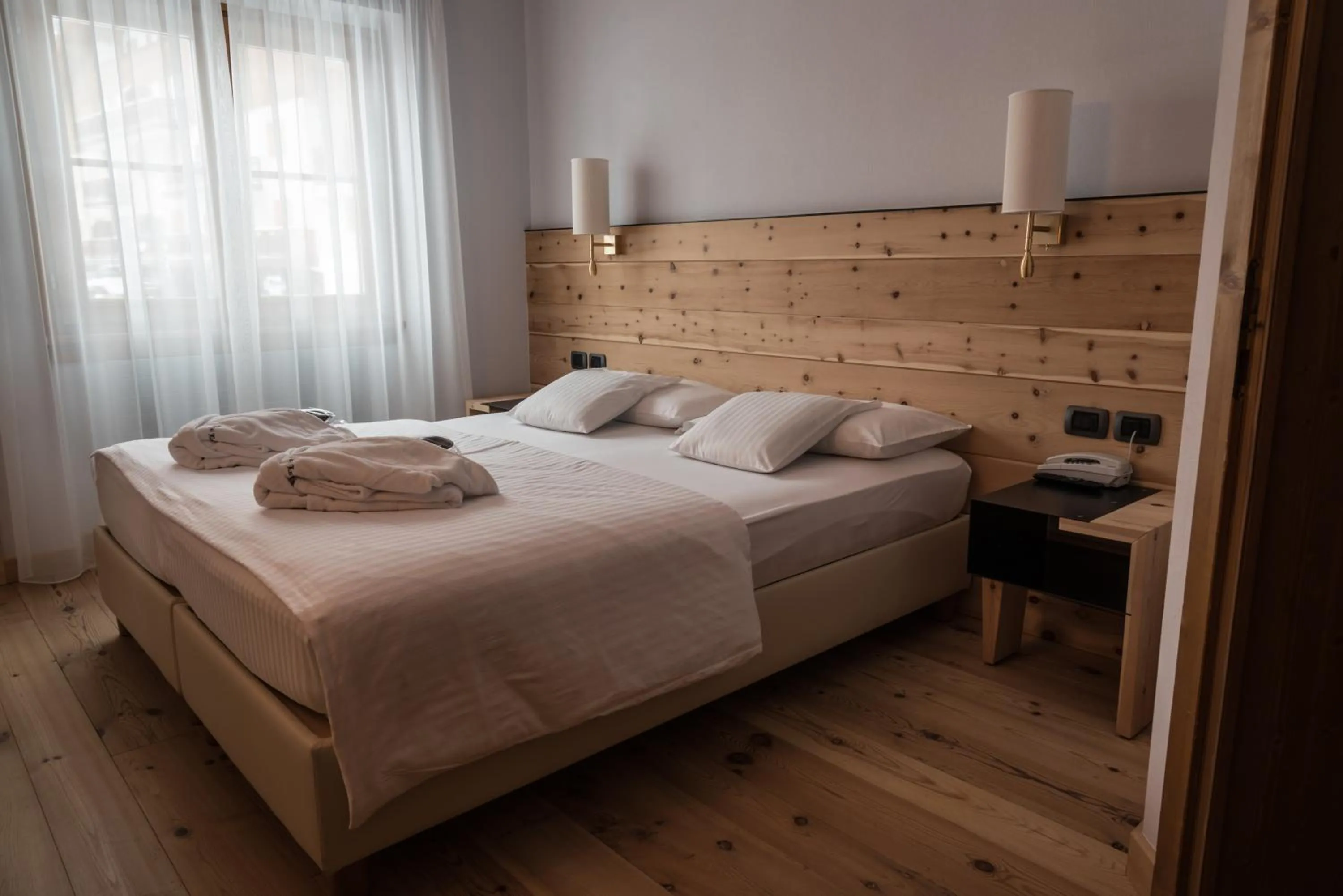 Bed in Chalet Laura Lodge Hotel