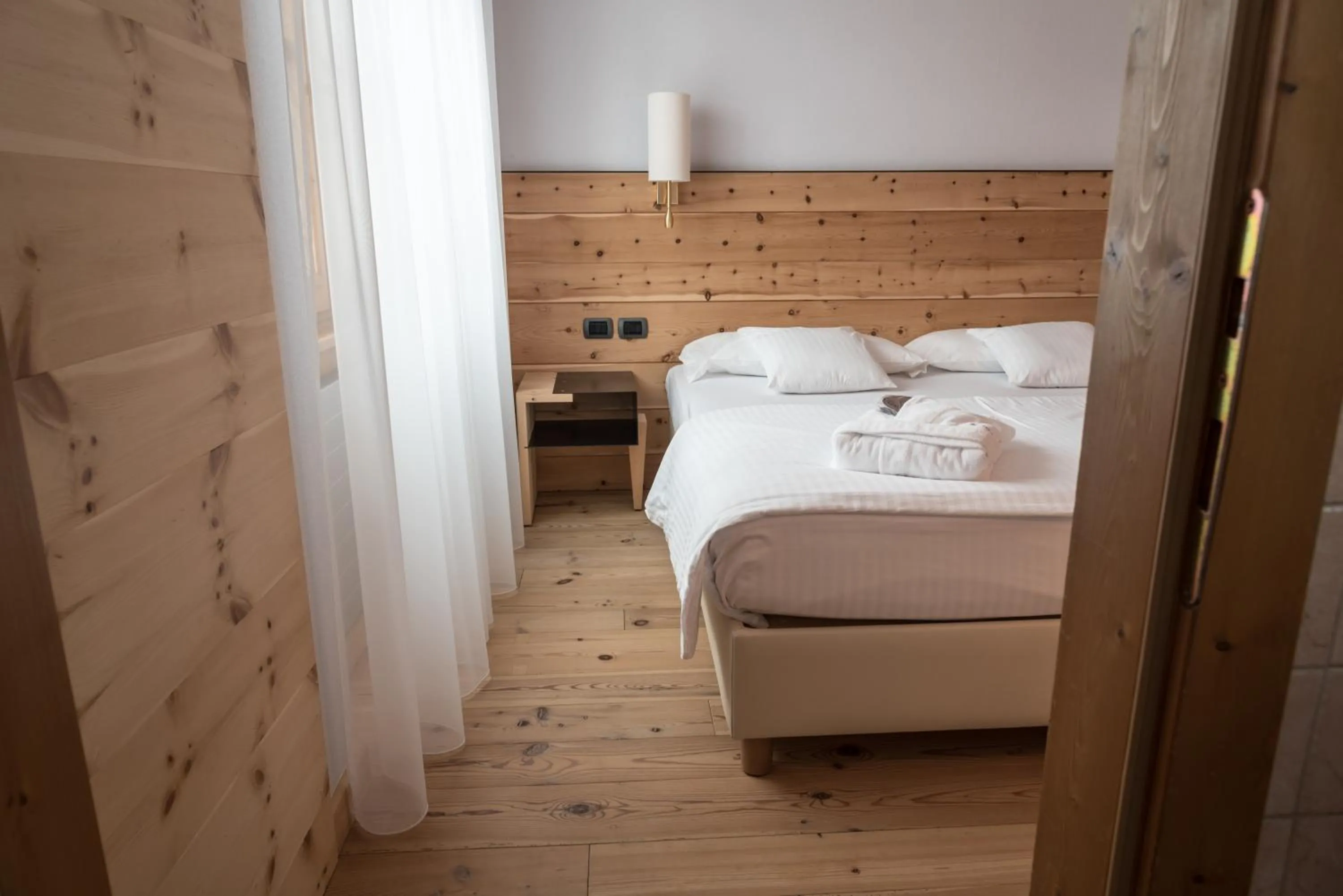 Bed in Chalet Laura Lodge Hotel