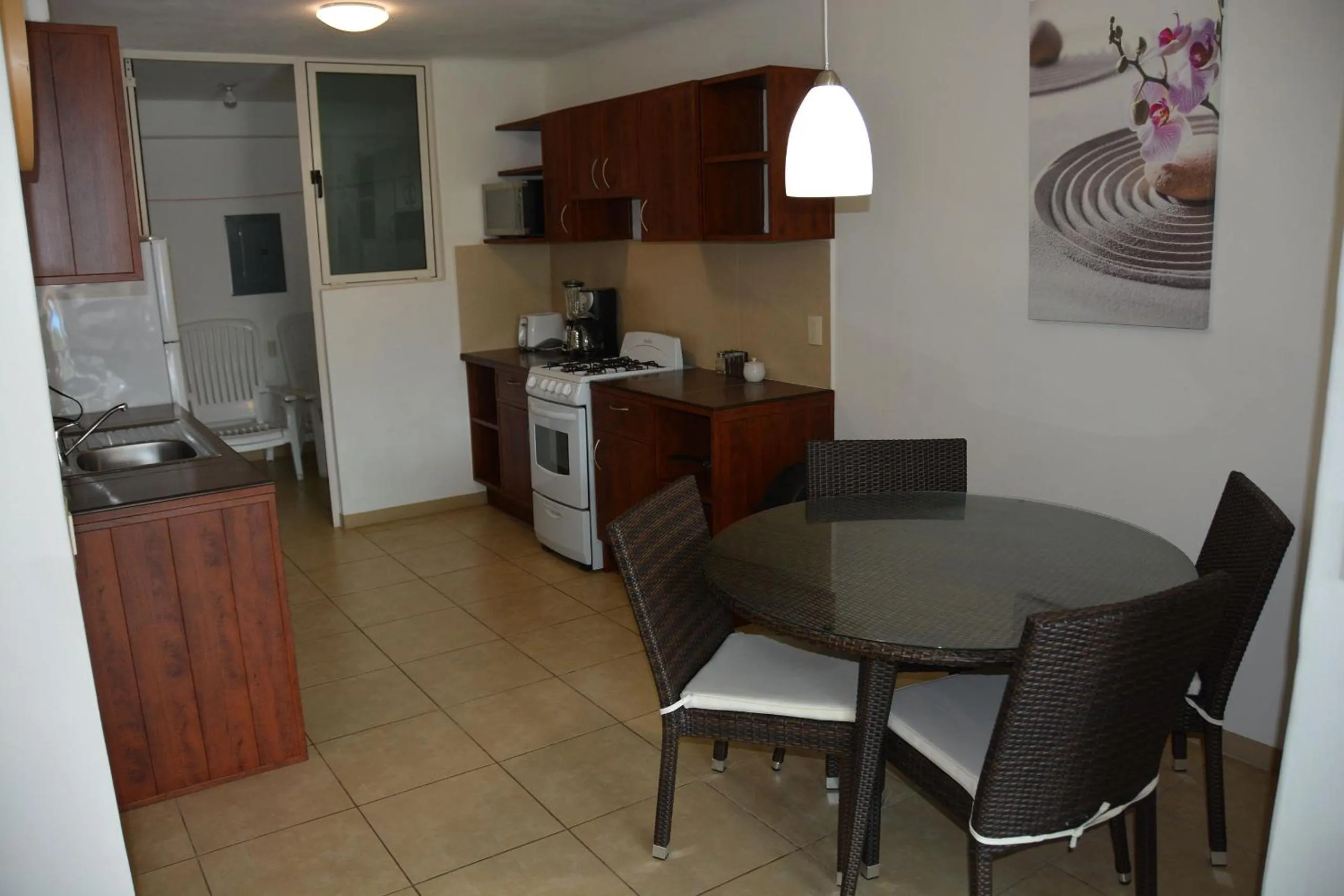Kitchen or kitchenette in Zenharmony Suites