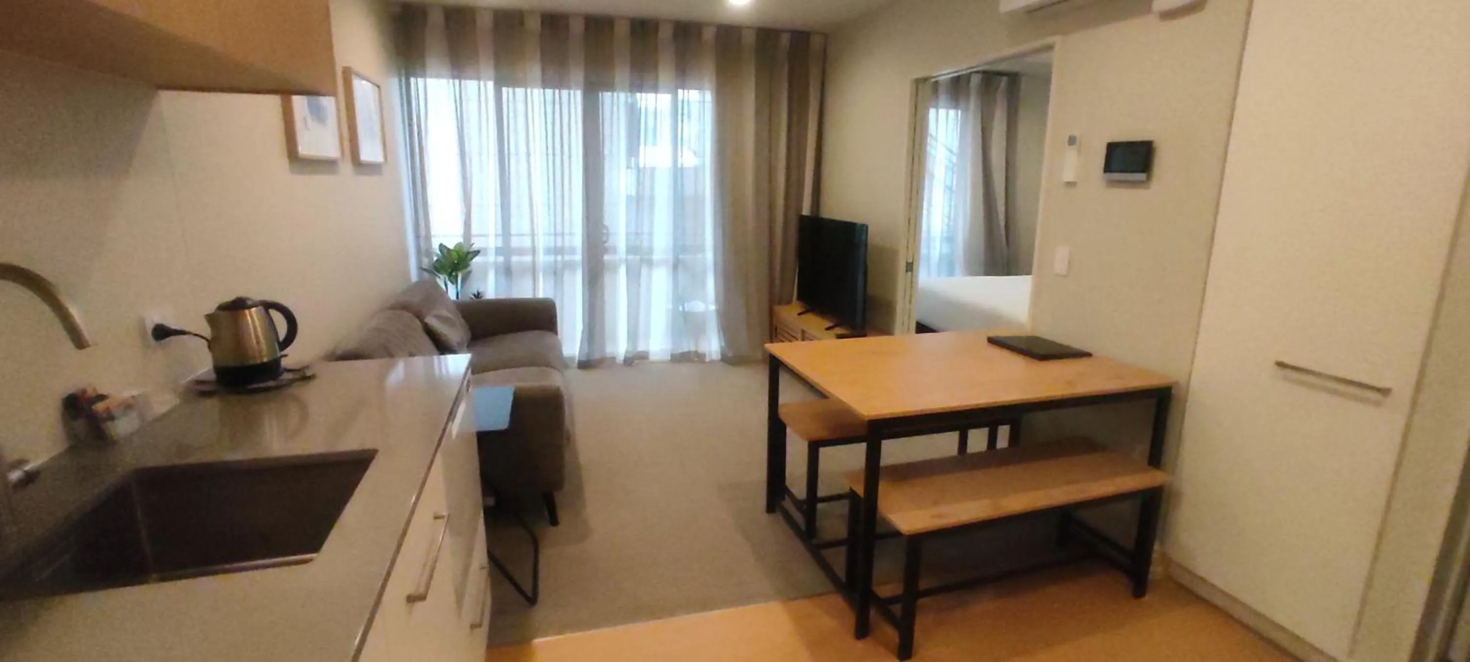 Kitchen or kitchenette in West Fitzroy Apartments