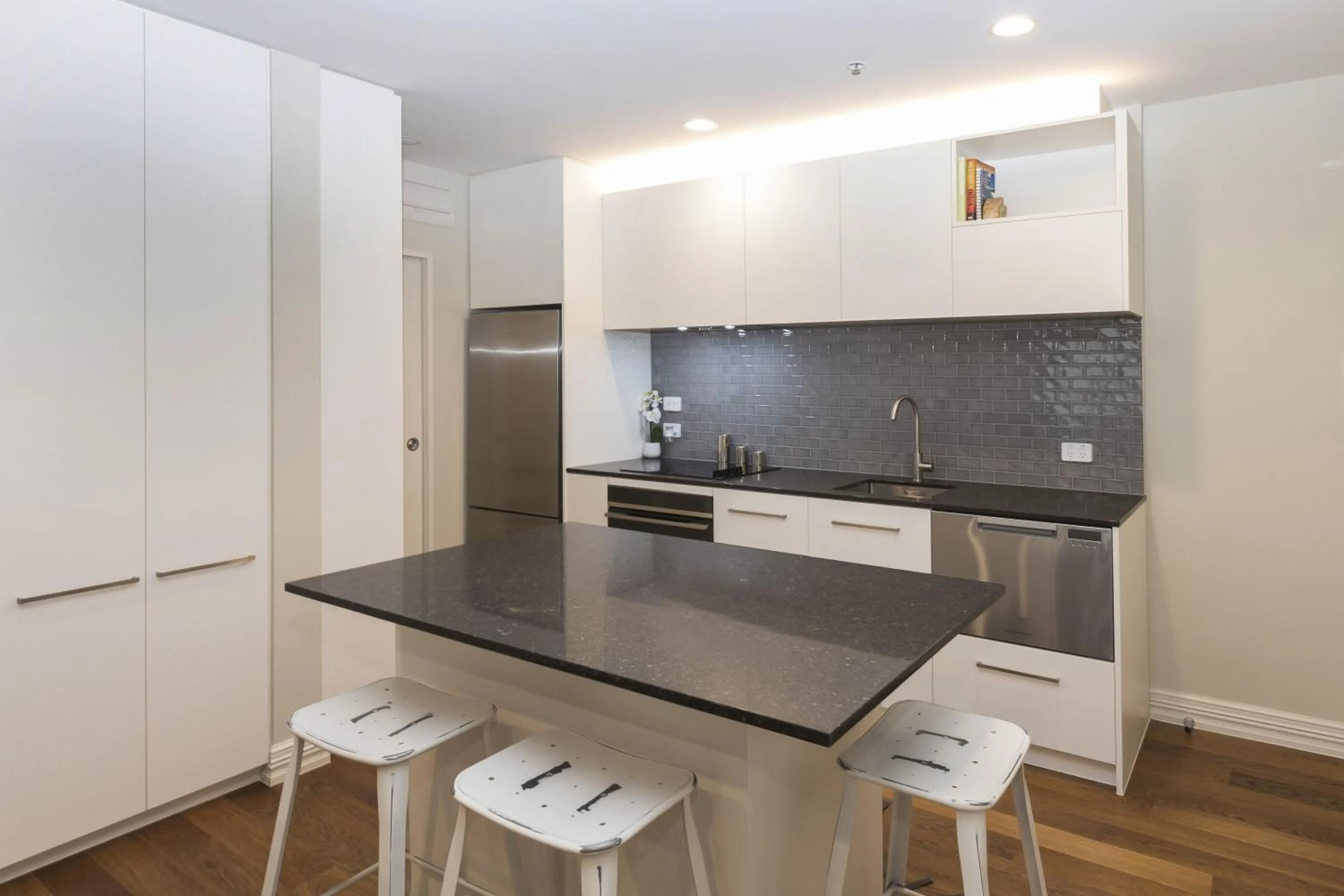 Kitchen or kitchenette in West Fitzroy Apartments