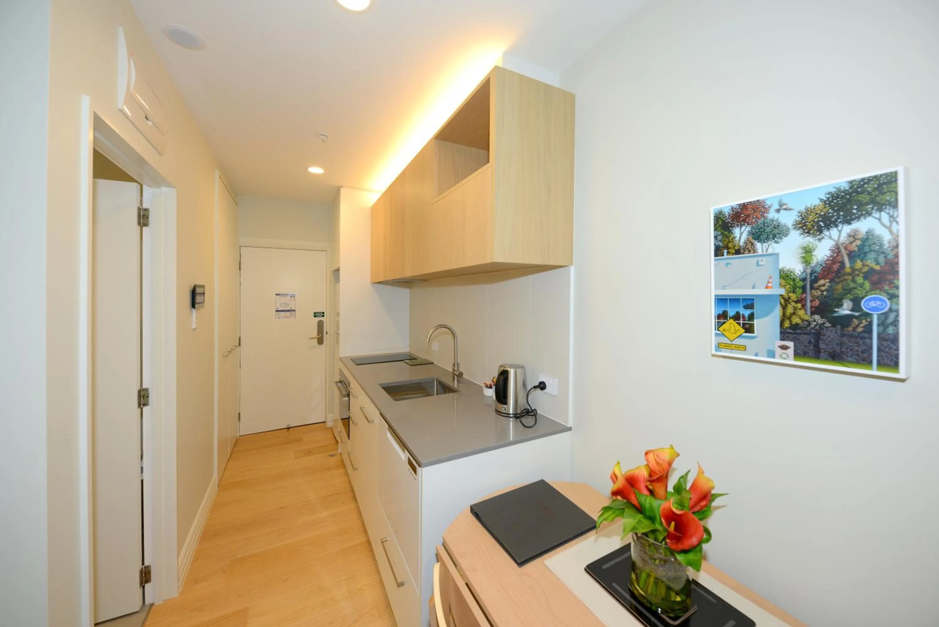 Kitchen or kitchenette in West Fitzroy Apartments