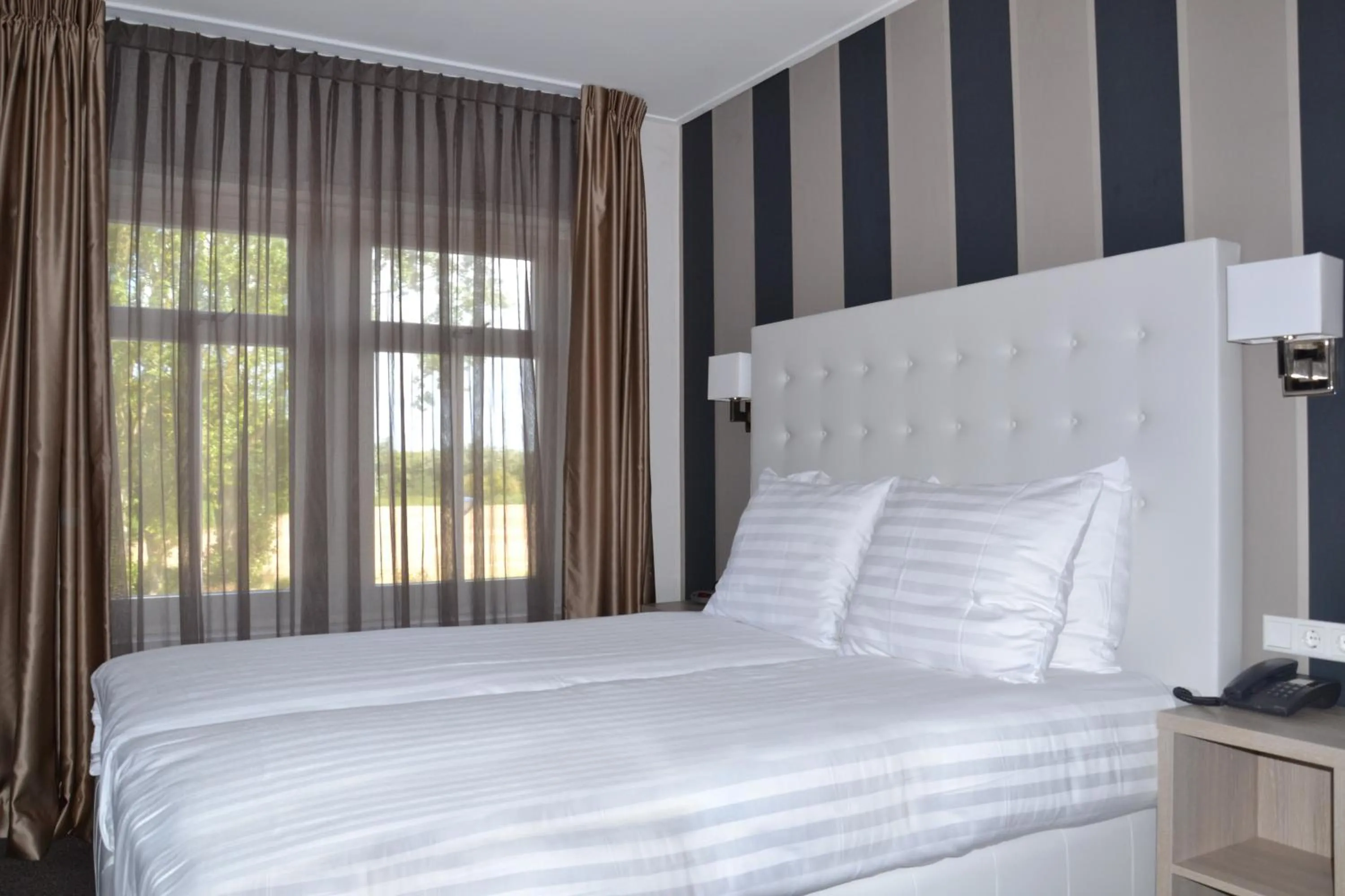 Bed in Fletcher Hotel-Restaurant Duinzicht