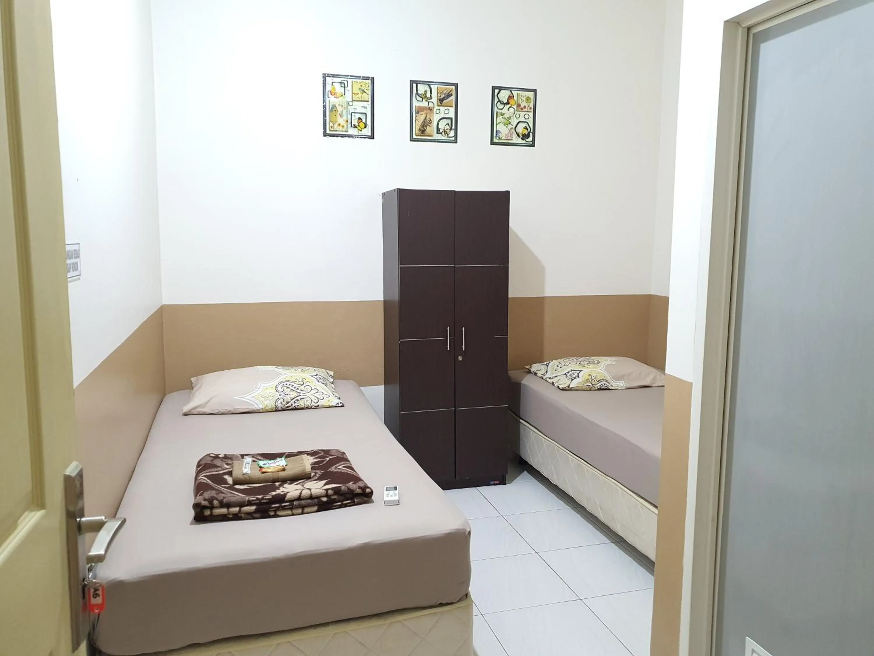 Bedroom, Bed in Delta Inn Bogor Syariah for Indonesian Only
