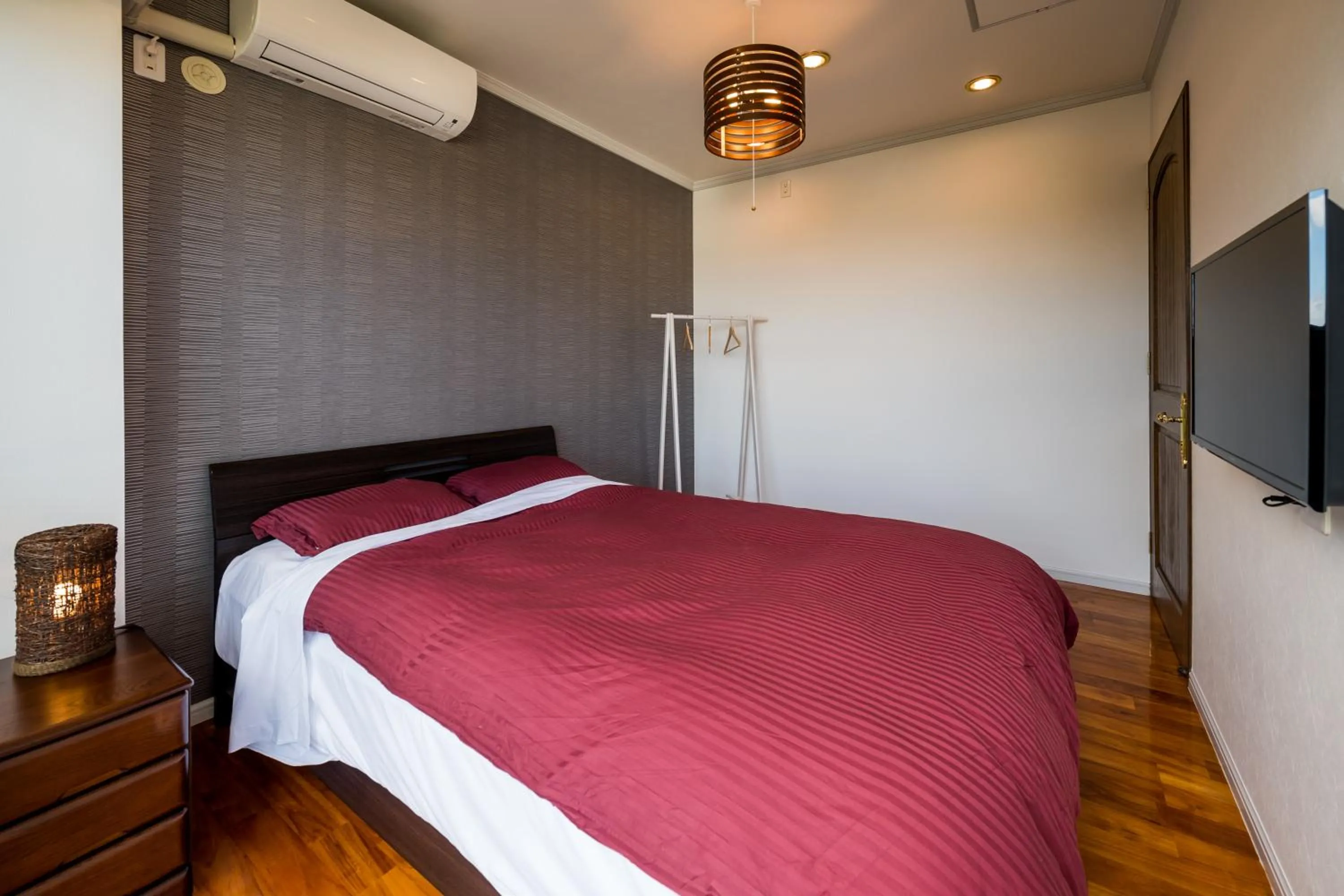 Bedroom, Bed in E-horizon Resort Condominium Yomitan