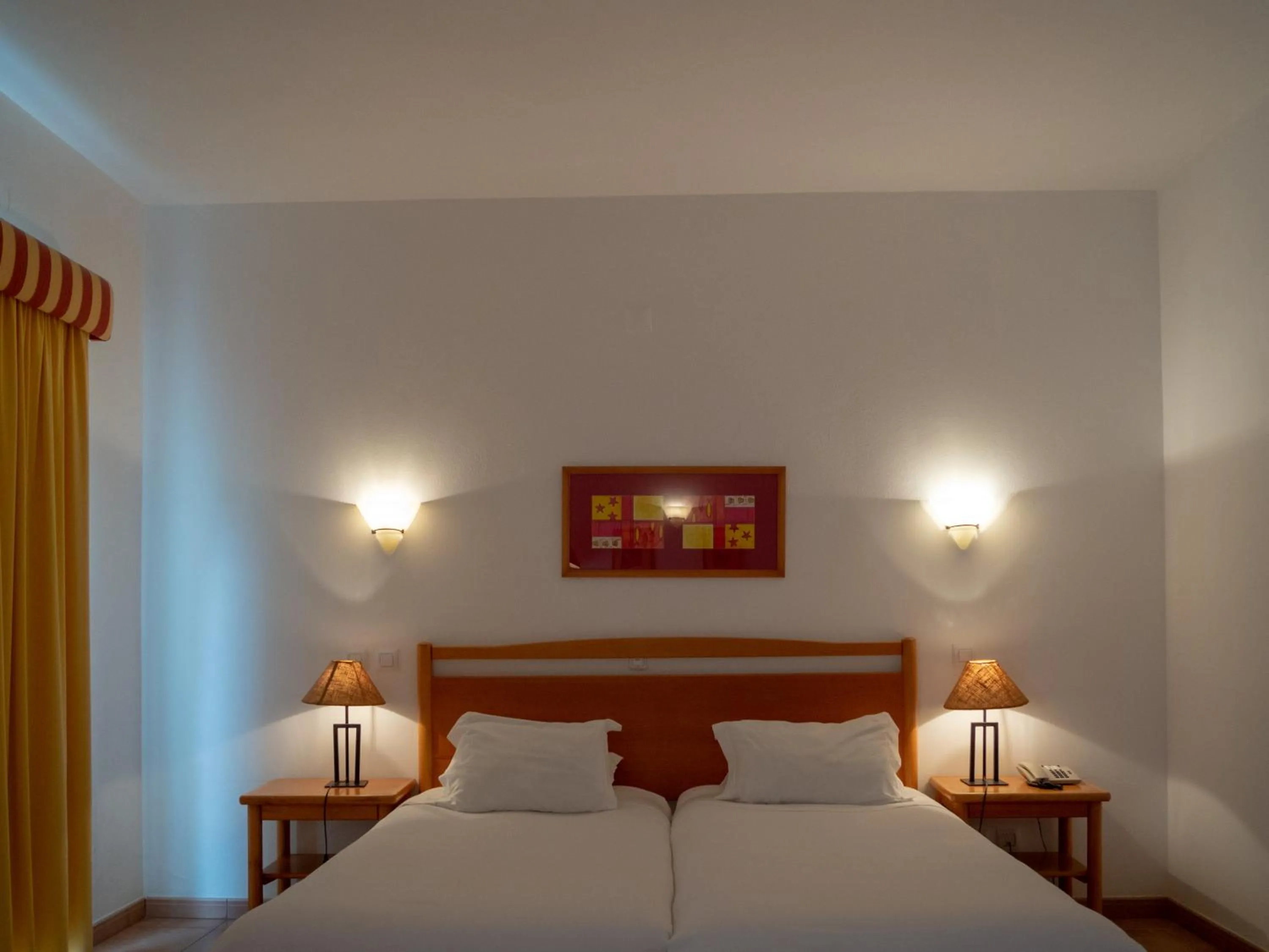 Bed in Luz Bay Hotel