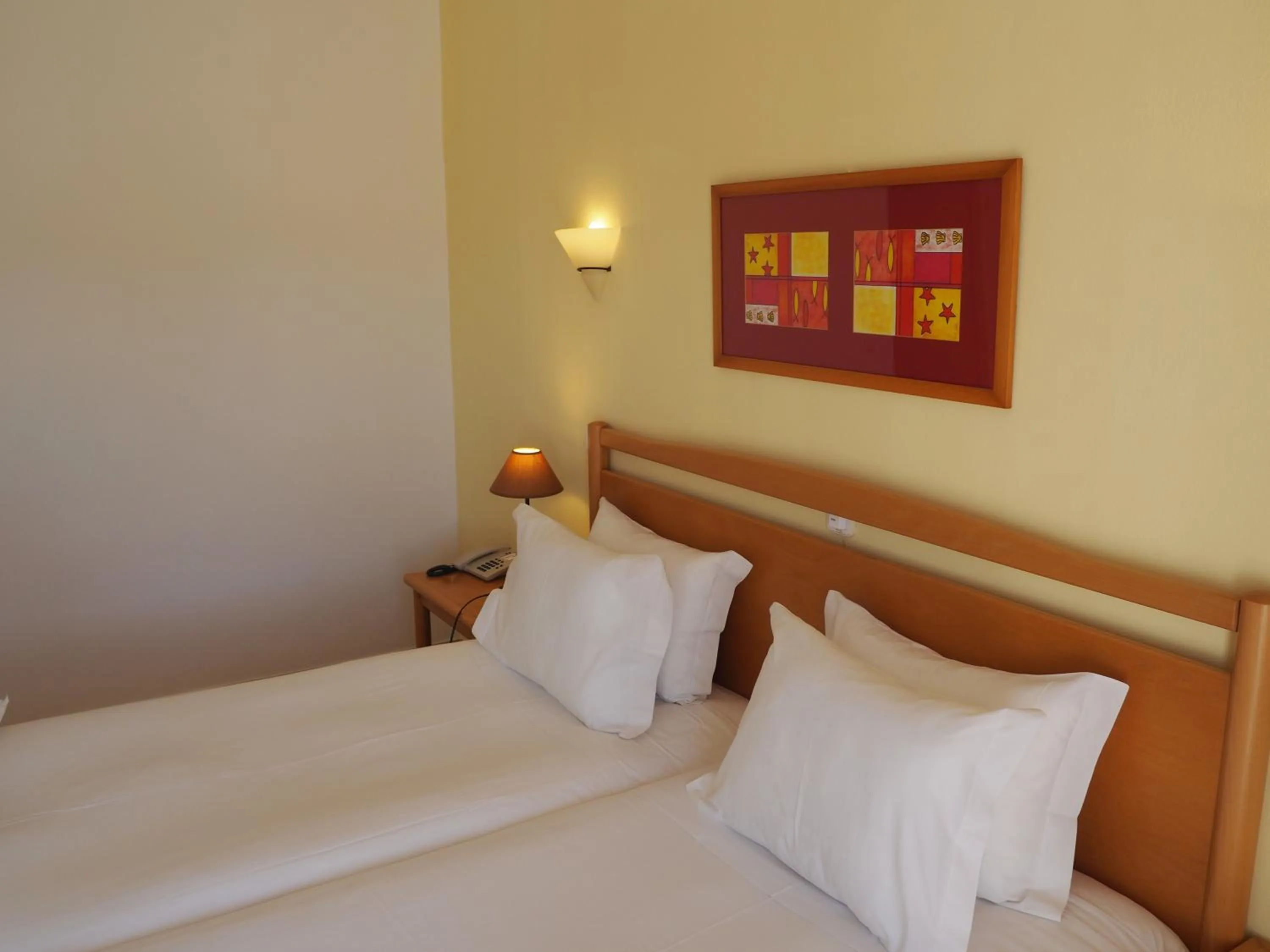 Bed in Luz Bay Hotel