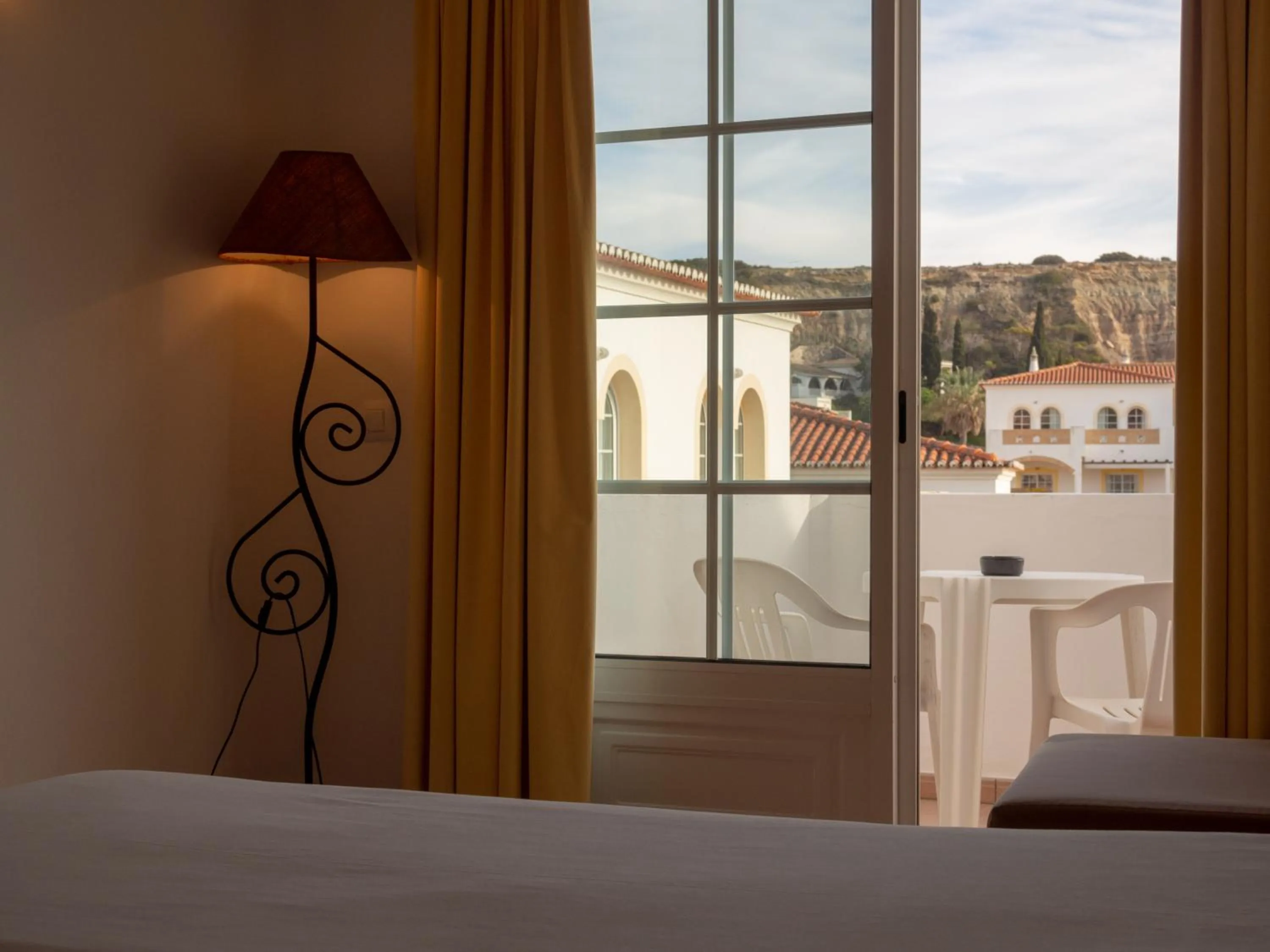 Bed in Luz Bay Hotel