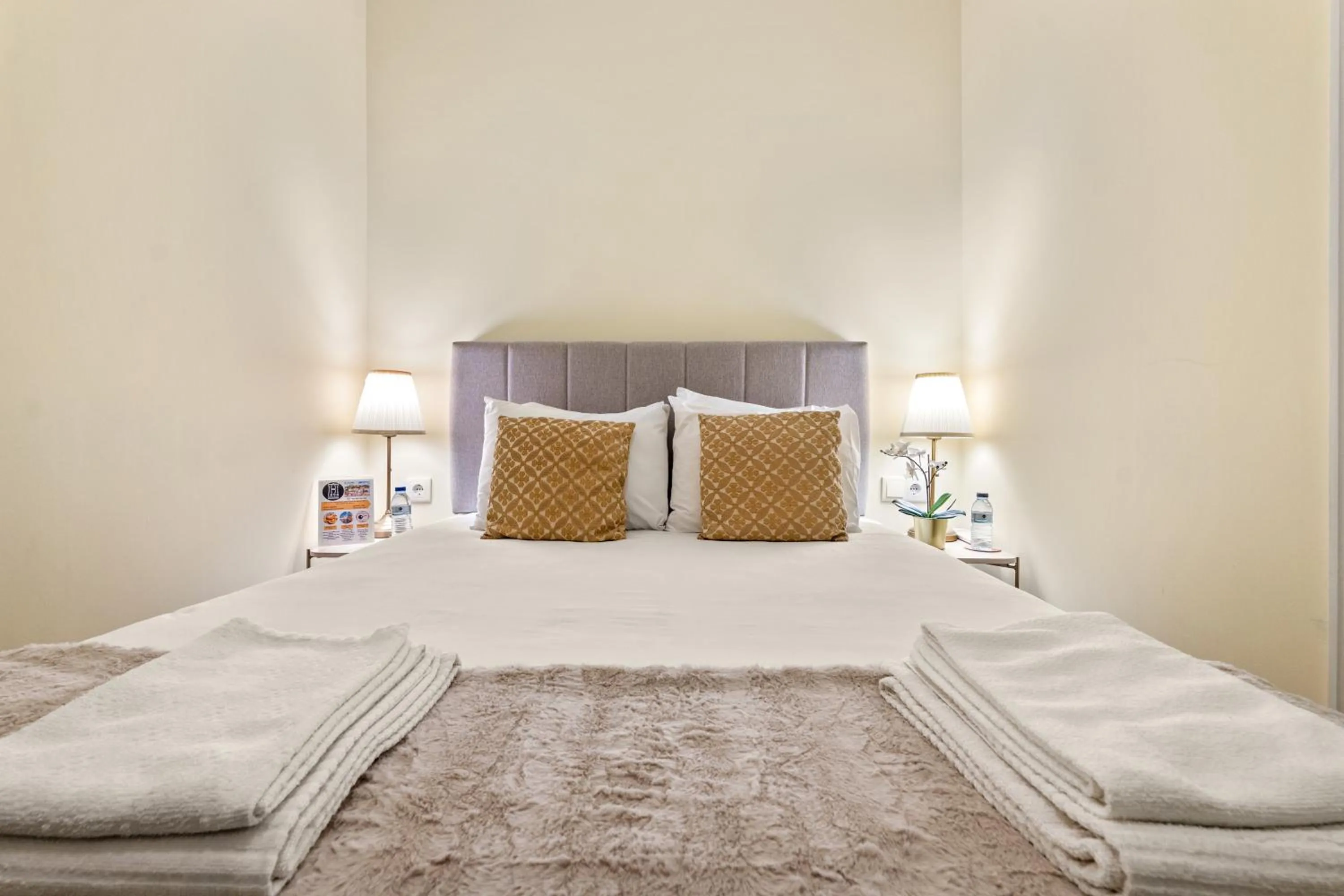 Bed in 1898 Home & Suites