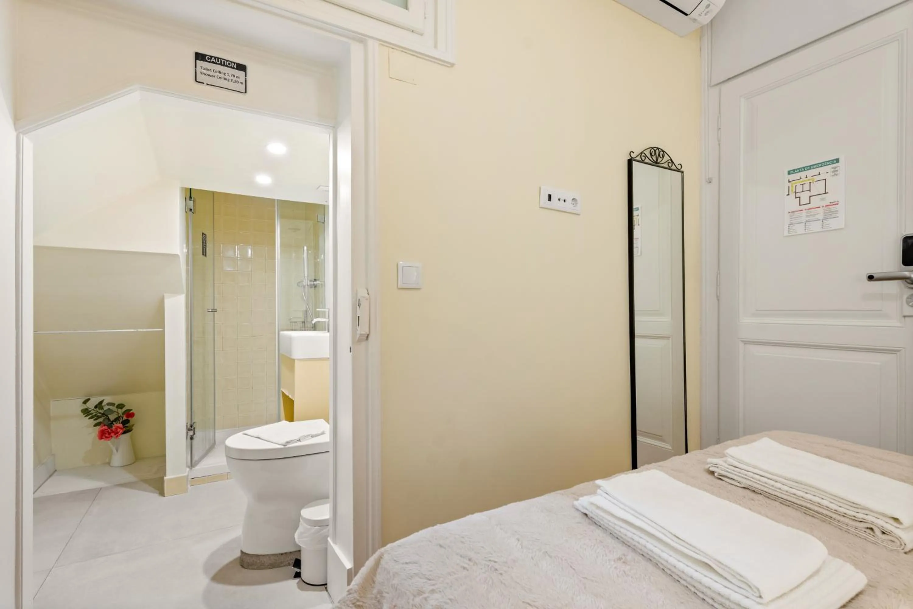 Bed in 1898 Home & Suites