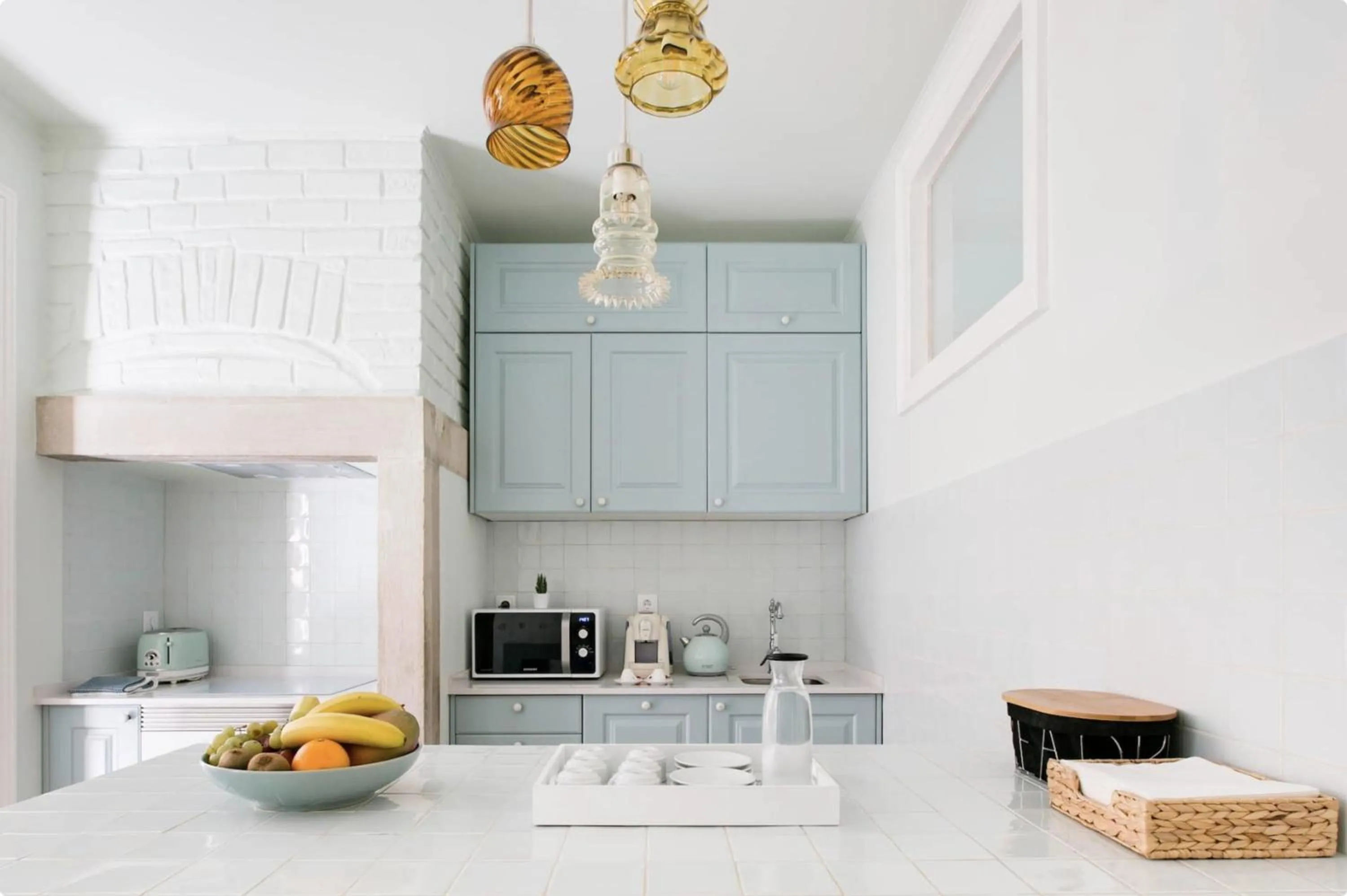 Communal kitchen in 1898 Home & Suites