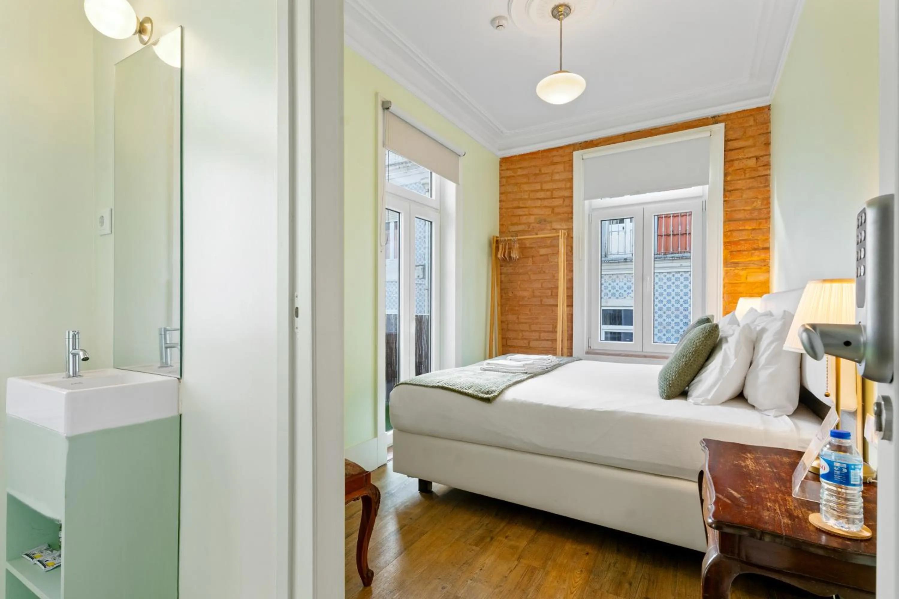 Bed in 1898 Home & Suites