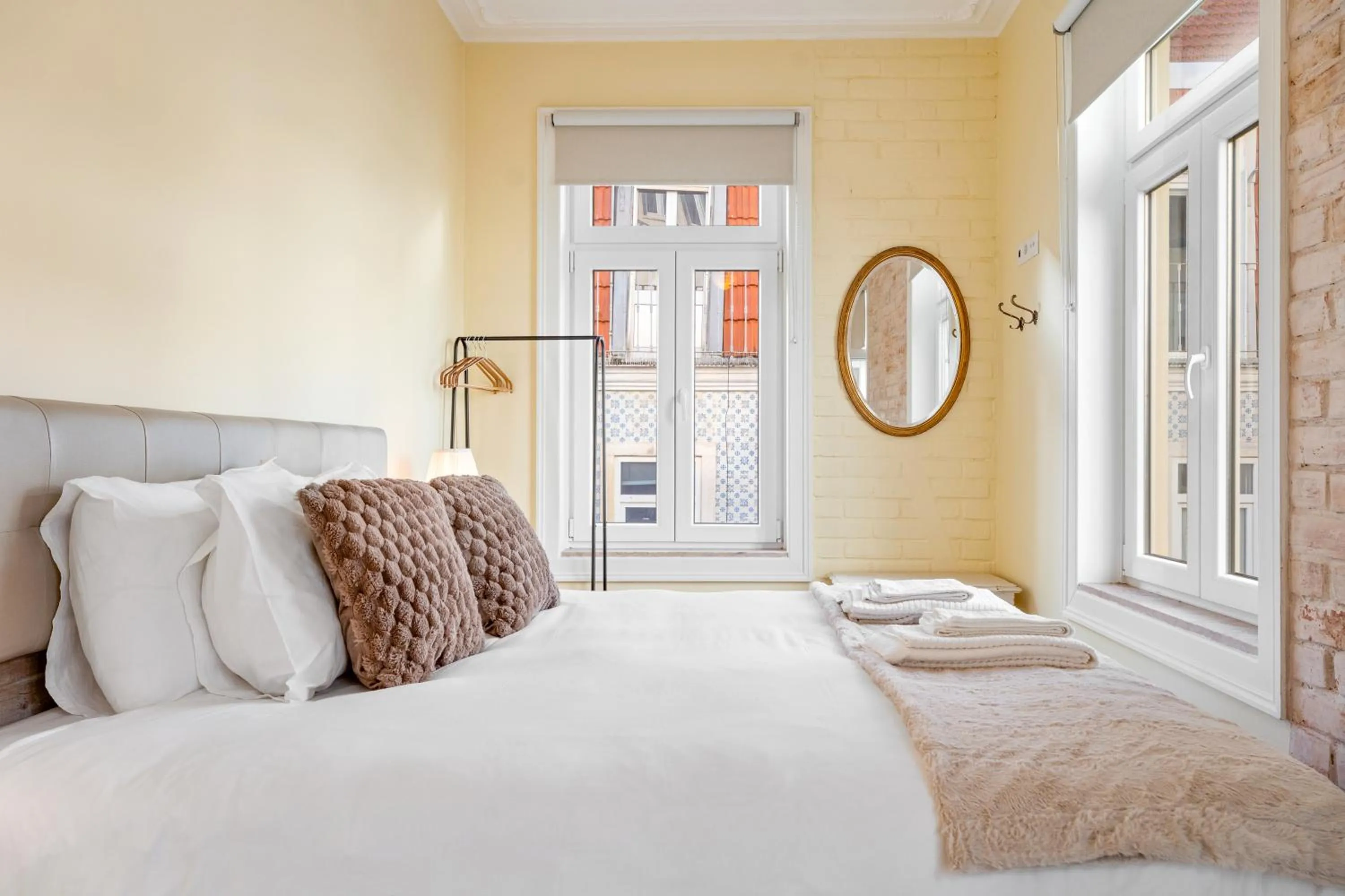 Bed in 1898 Home & Suites