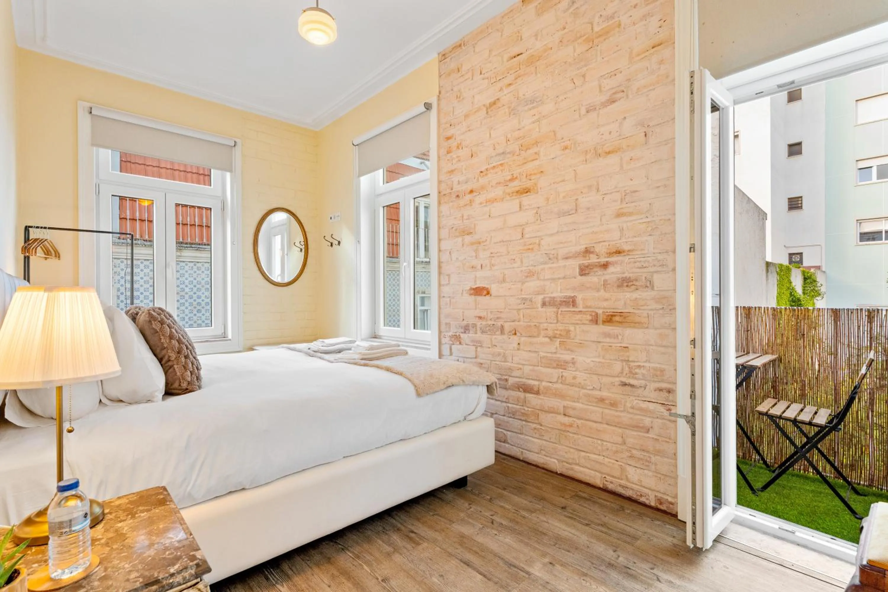 Bed in 1898 Home & Suites