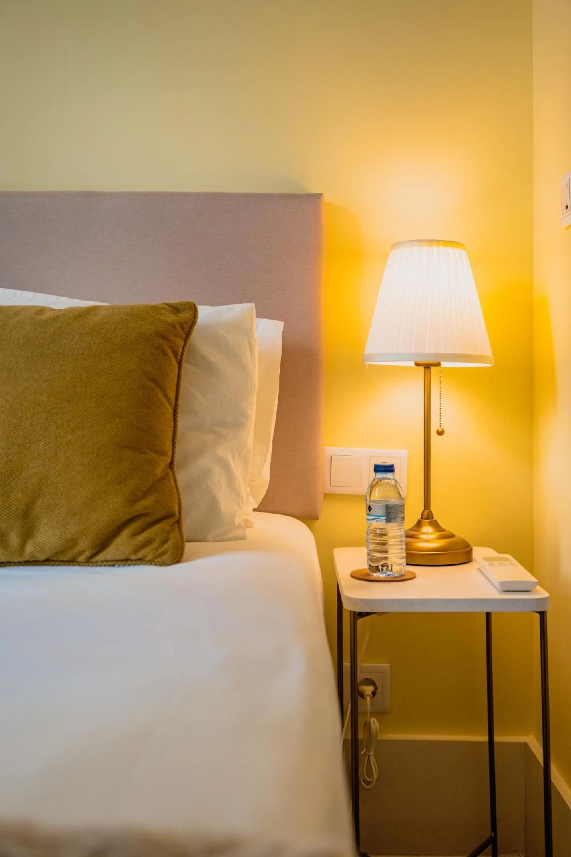 Bed in 1898 Home & Suites