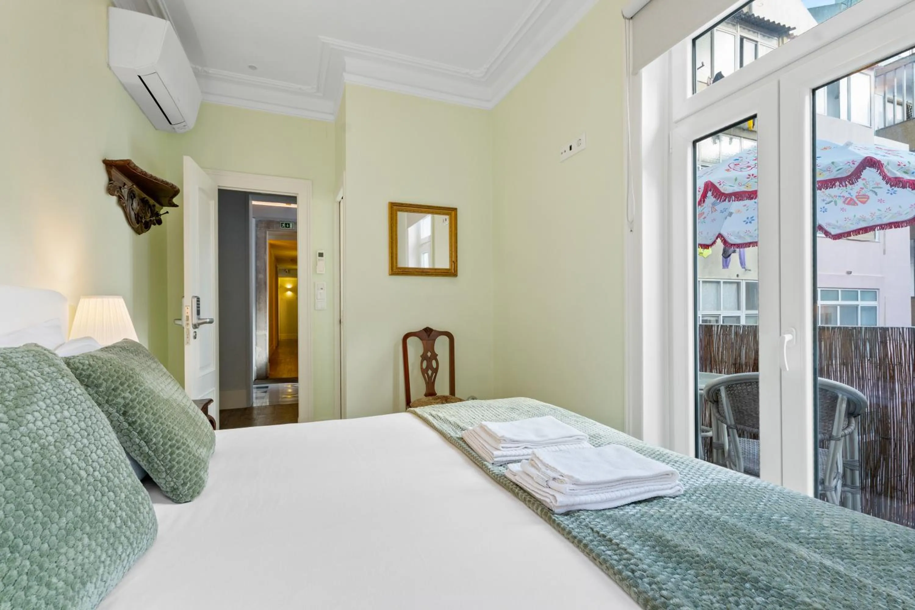 Bed in 1898 Home & Suites