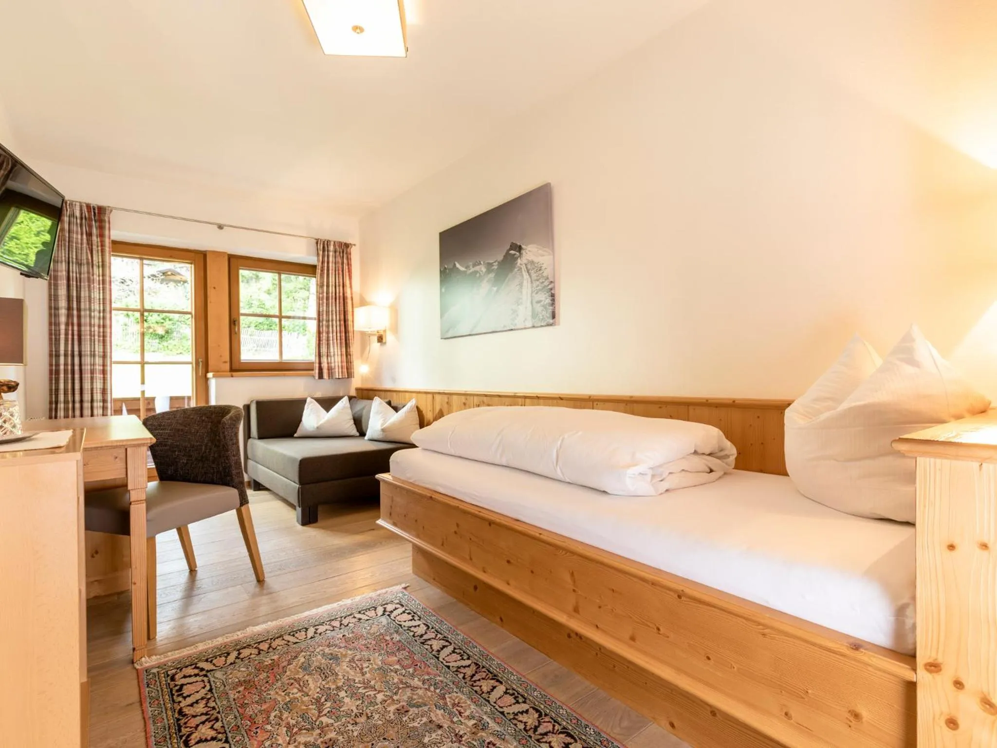 Living room, Bed in Gästehaus Gratlspitz