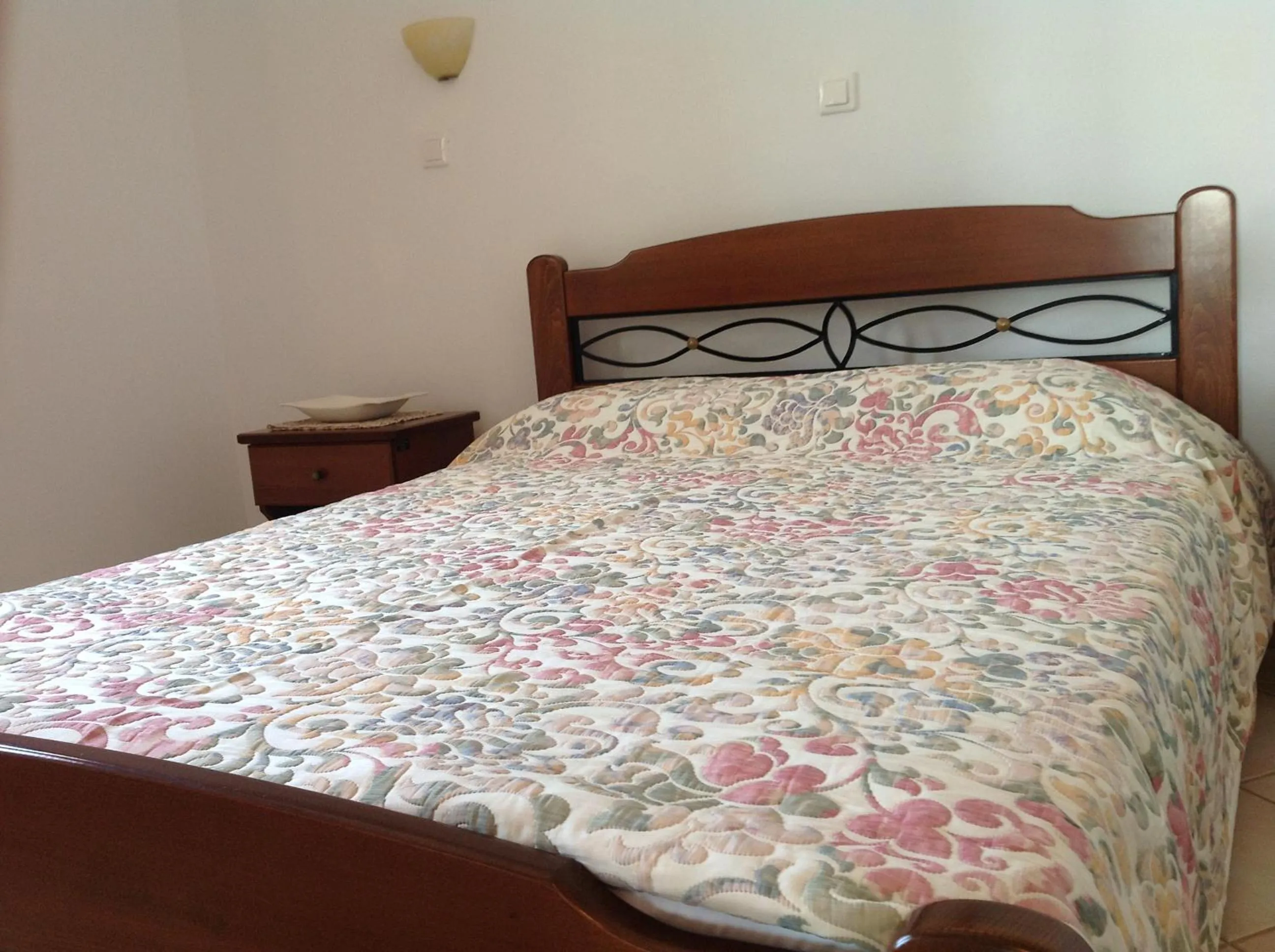 Bed in Golden Sun Apartments