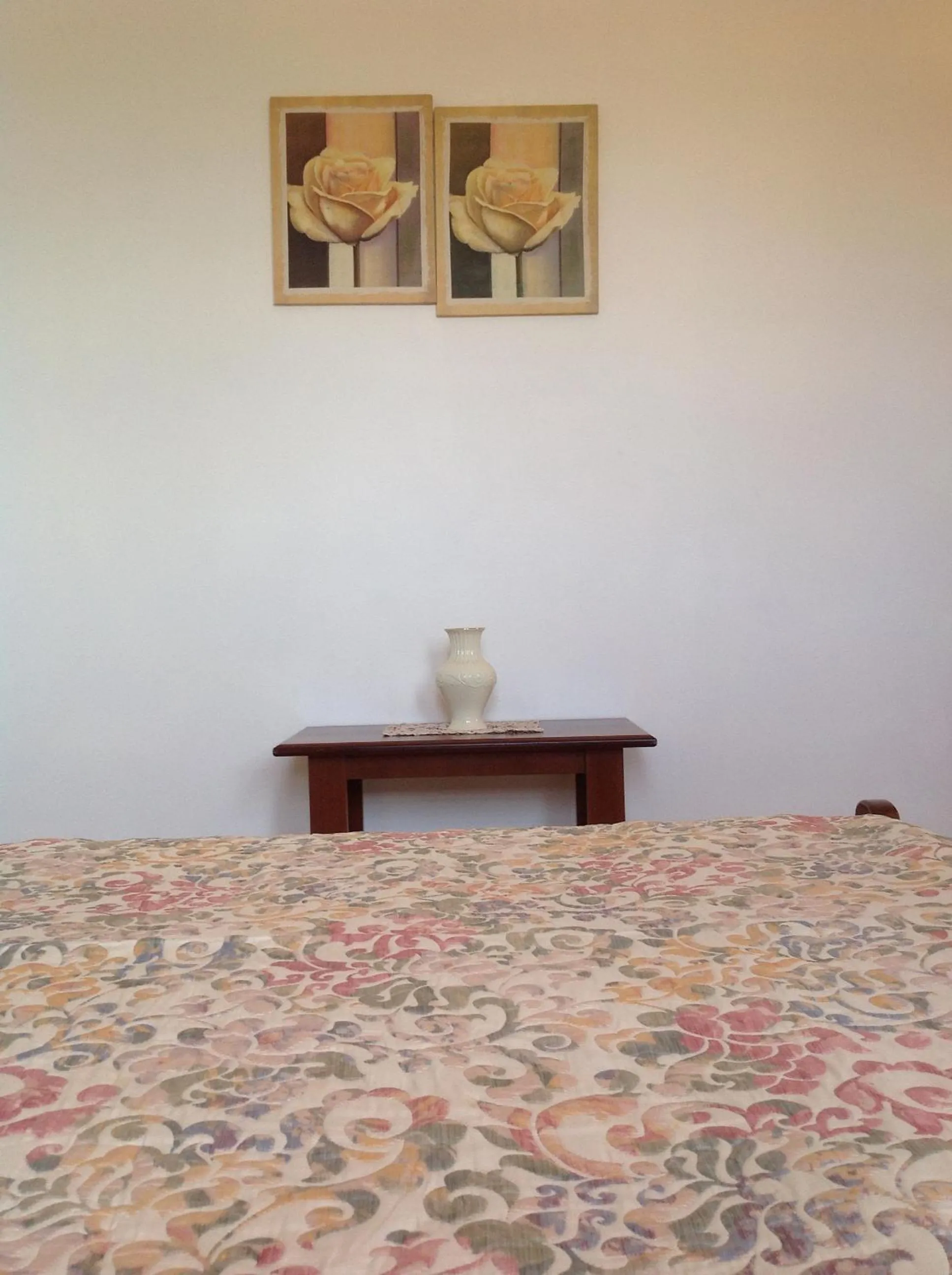 Bed in Golden Sun Apartments