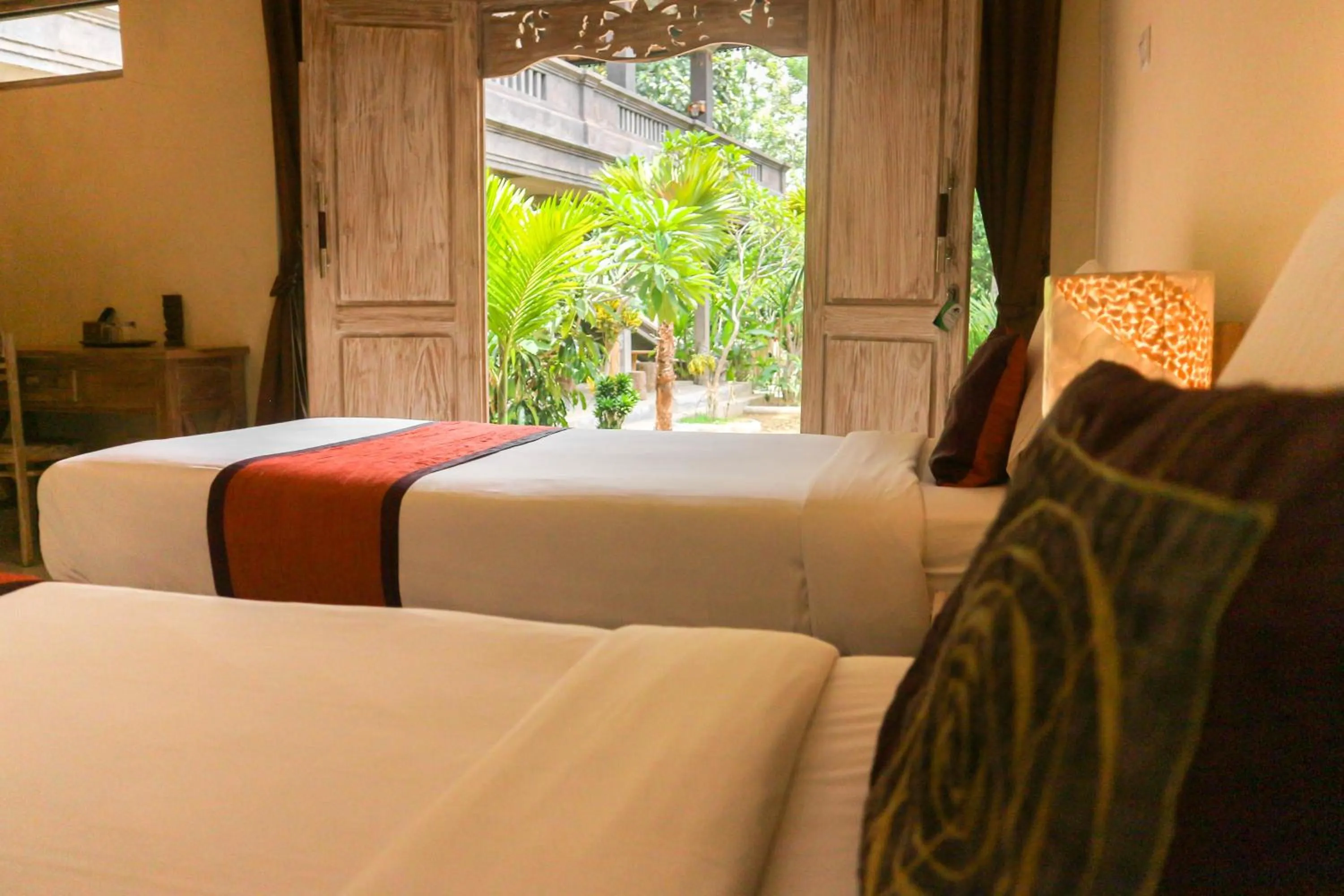 Photo of the whole room, Bed in The Lumbung Jaya by Uniquecations