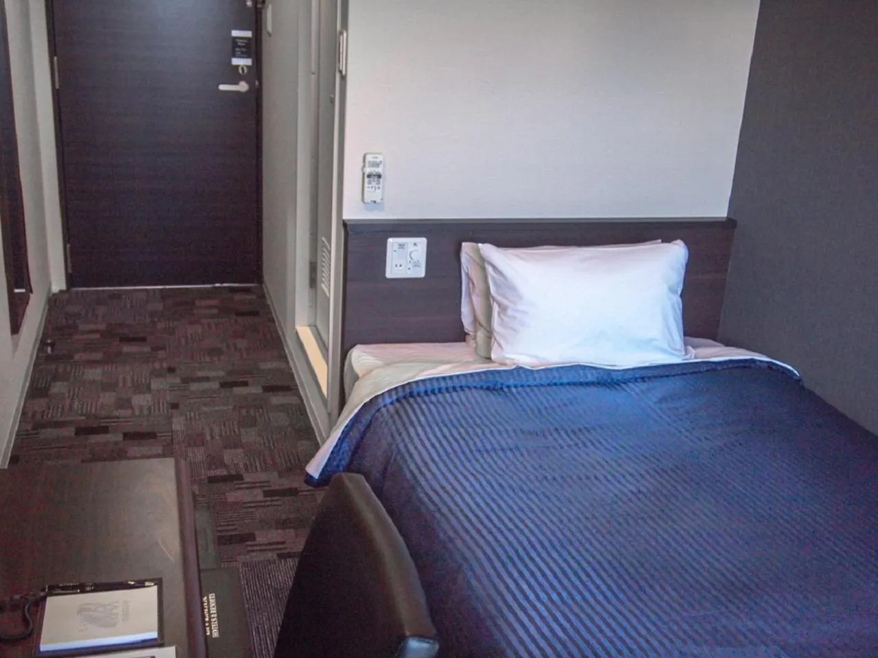 Bed in HOTEL LiVEMAX BUDGET Nagoya Taikodori