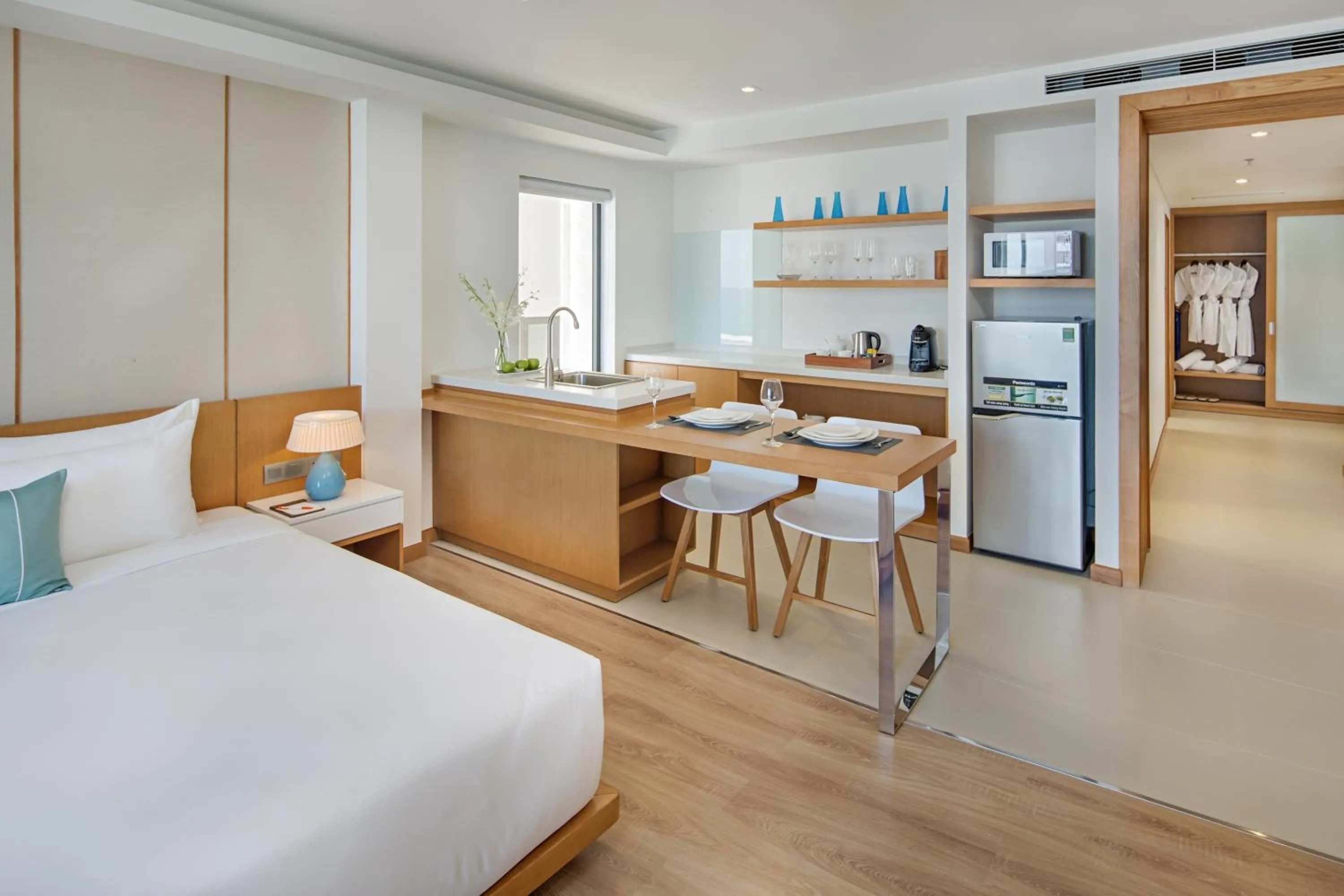 Kitchen or kitchenette, Bed in TMS Hotel Da Nang Beach