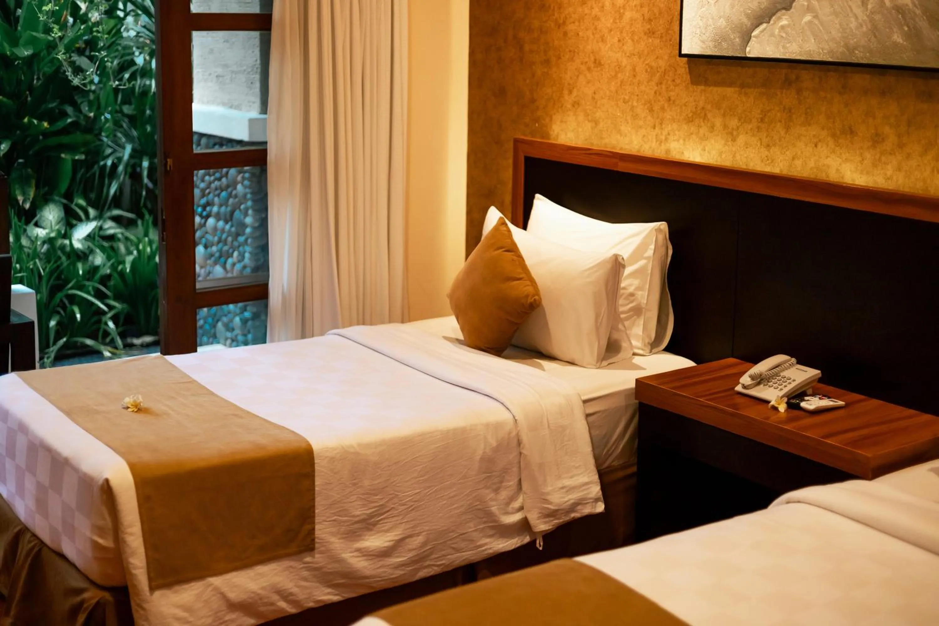 Bed in Fourteen Roses Beach Hotel