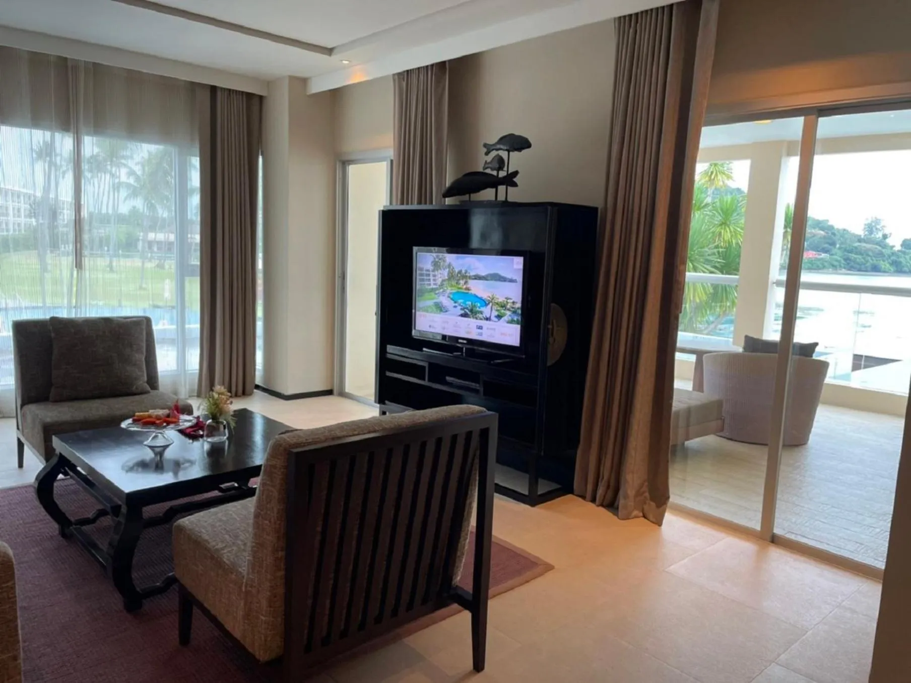 Photo of the whole room, TV/Entertainment Center in Phuket Panwa Beachfront Resort