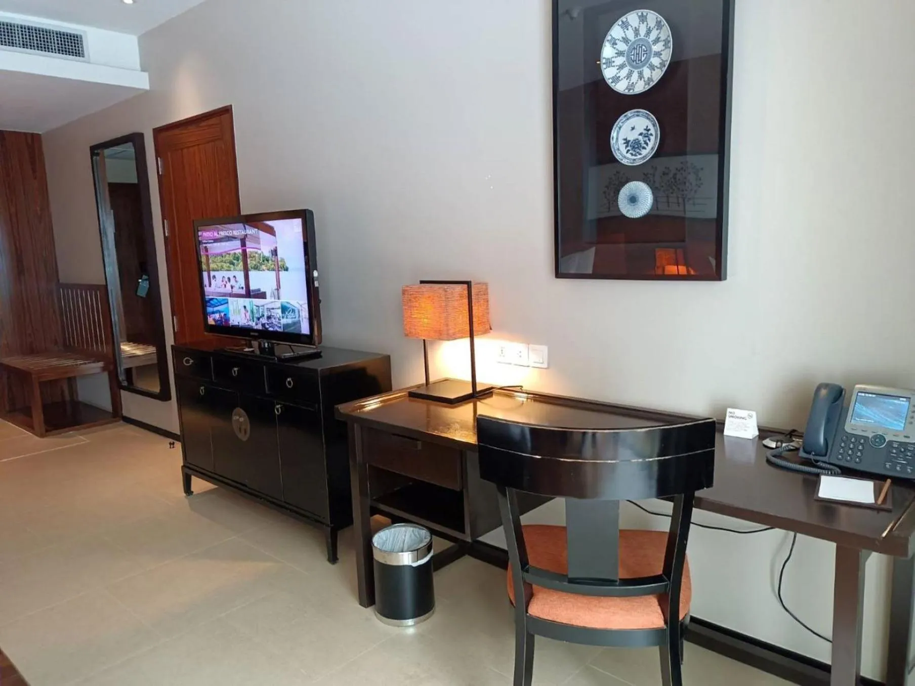 Photo of the whole room, TV/Entertainment Center in Phuket Panwa Beachfront Resort