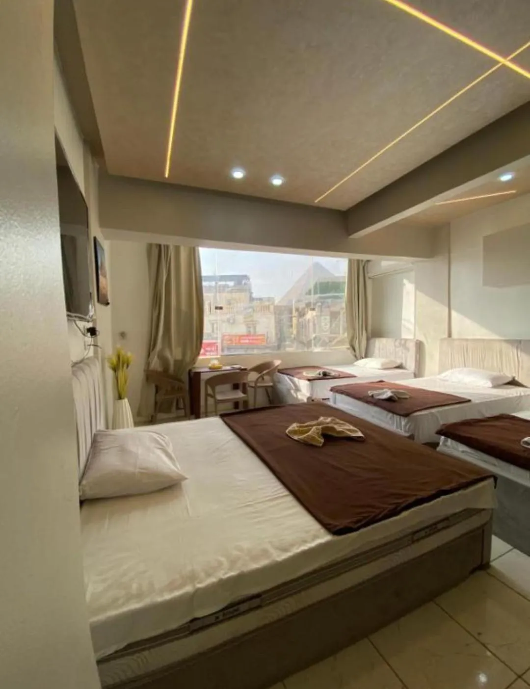 Bed in Pyramids Family Inn