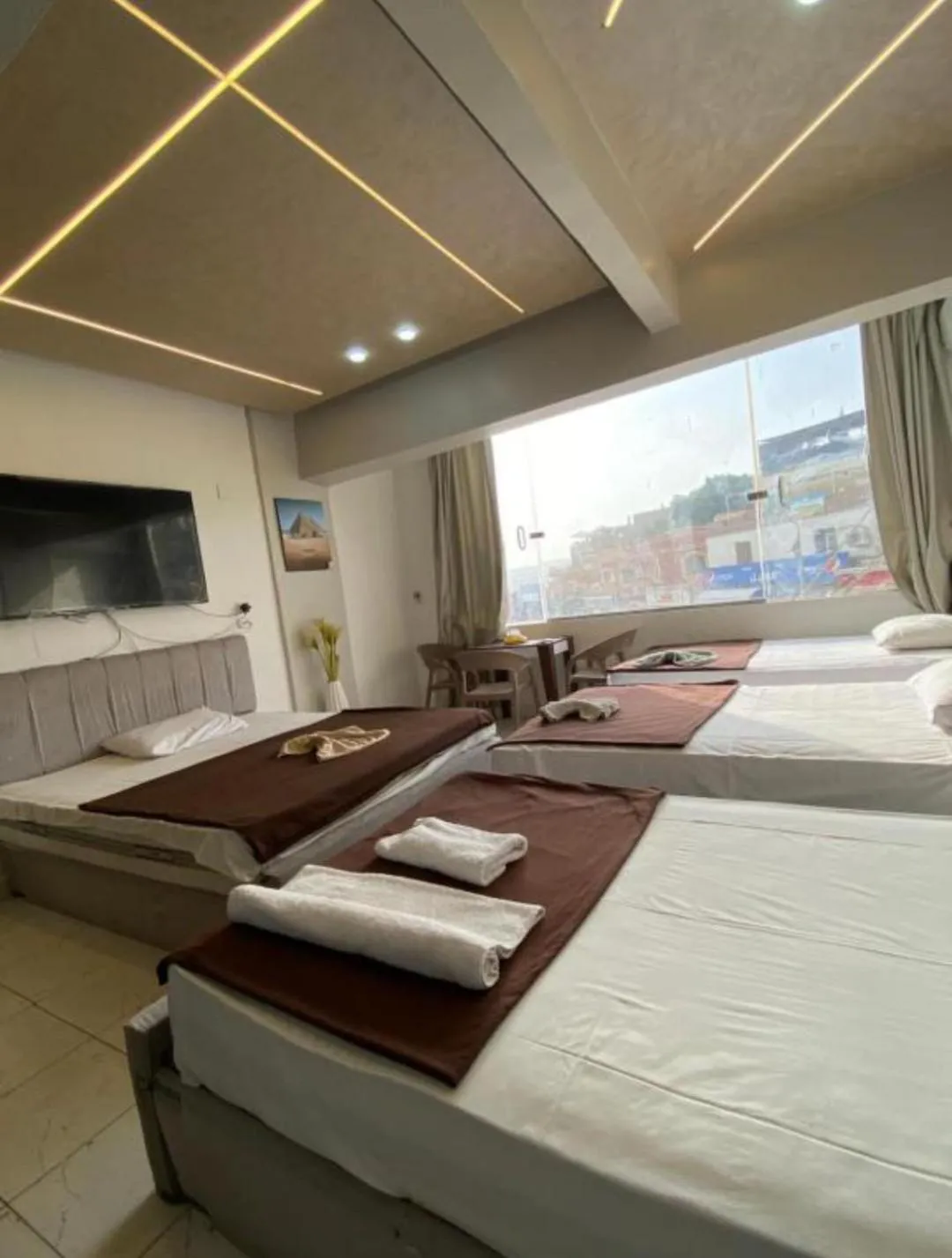 Bed in Pyramids Family Inn