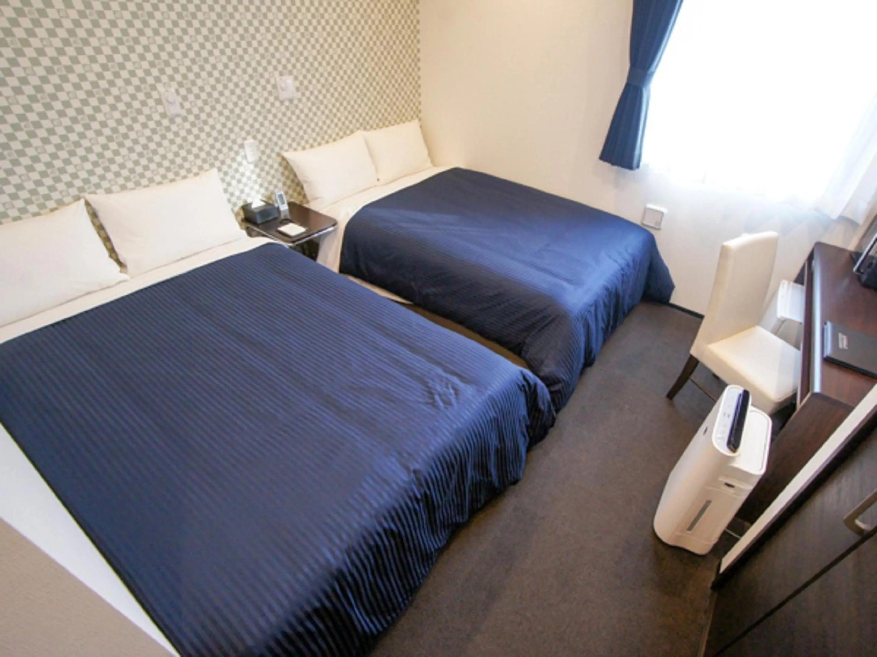 Bed in HOTEL LiVEMAX Minamihashimoto Ekimae