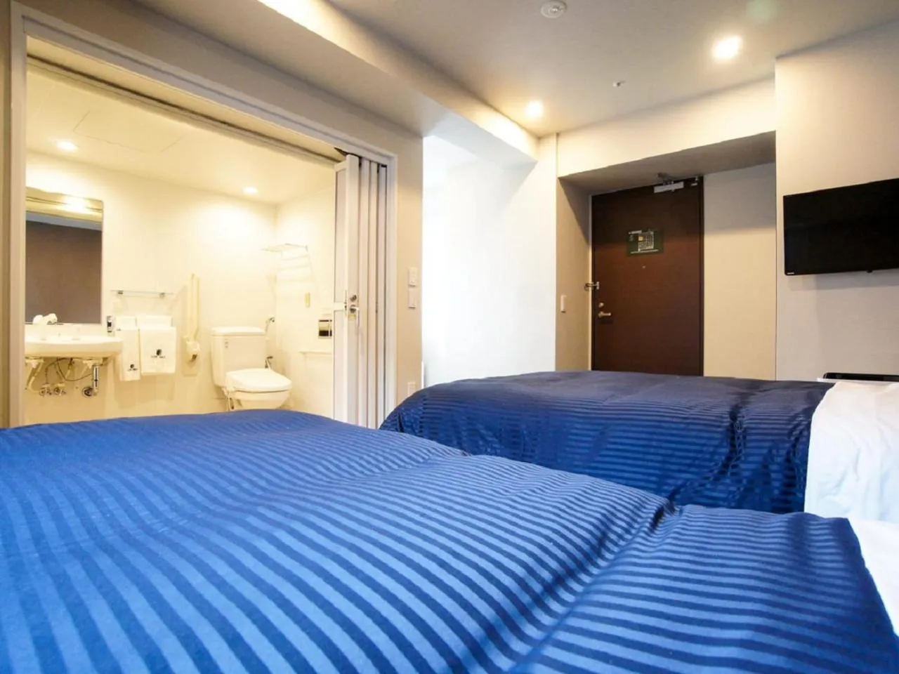 Bed in HOTEL LiVEMAX Yokohama Motomachi Ekimae