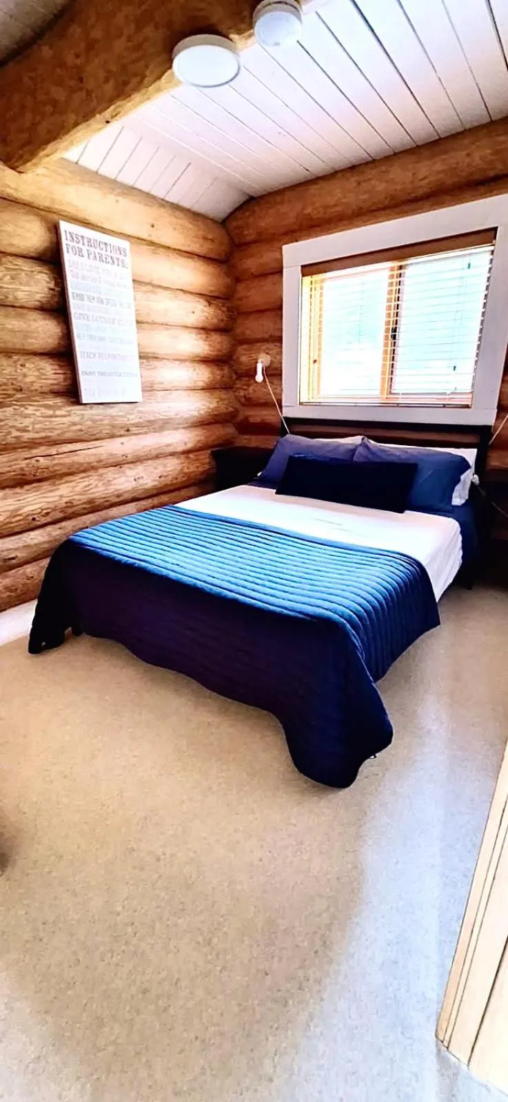 Bed in The Beach House Texada - Oceanfront Cabin