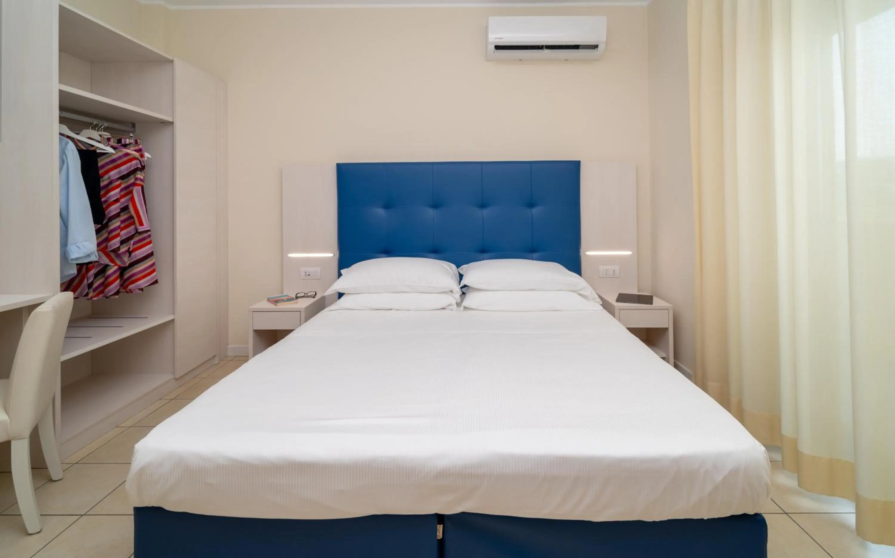 Bed in Hotel Riviera