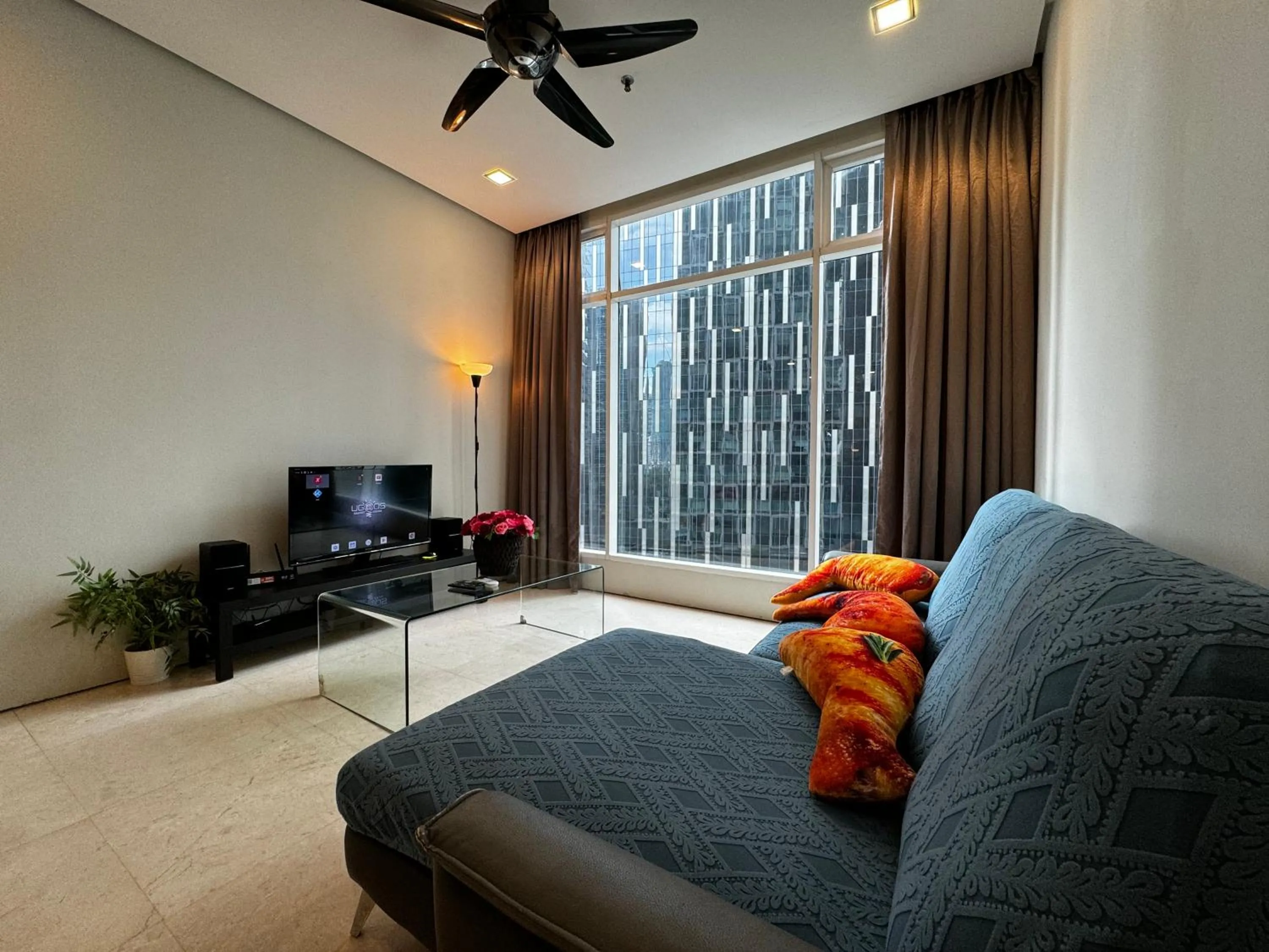 Communal lounge/ TV room in Soho Suites KLCC by Alucard's Cat