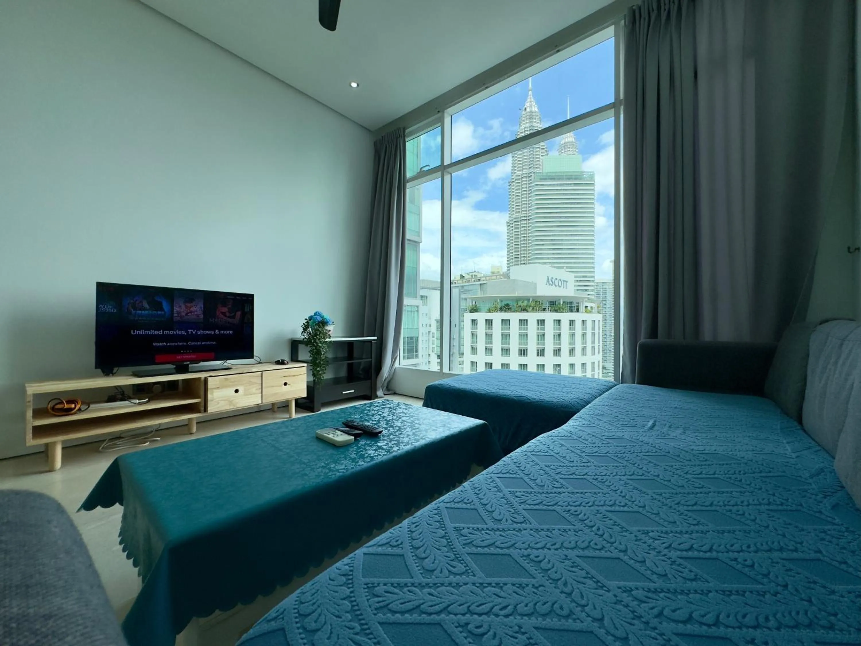 Communal lounge/ TV room, Bed in Soho Suites KLCC by Alucard's Cat