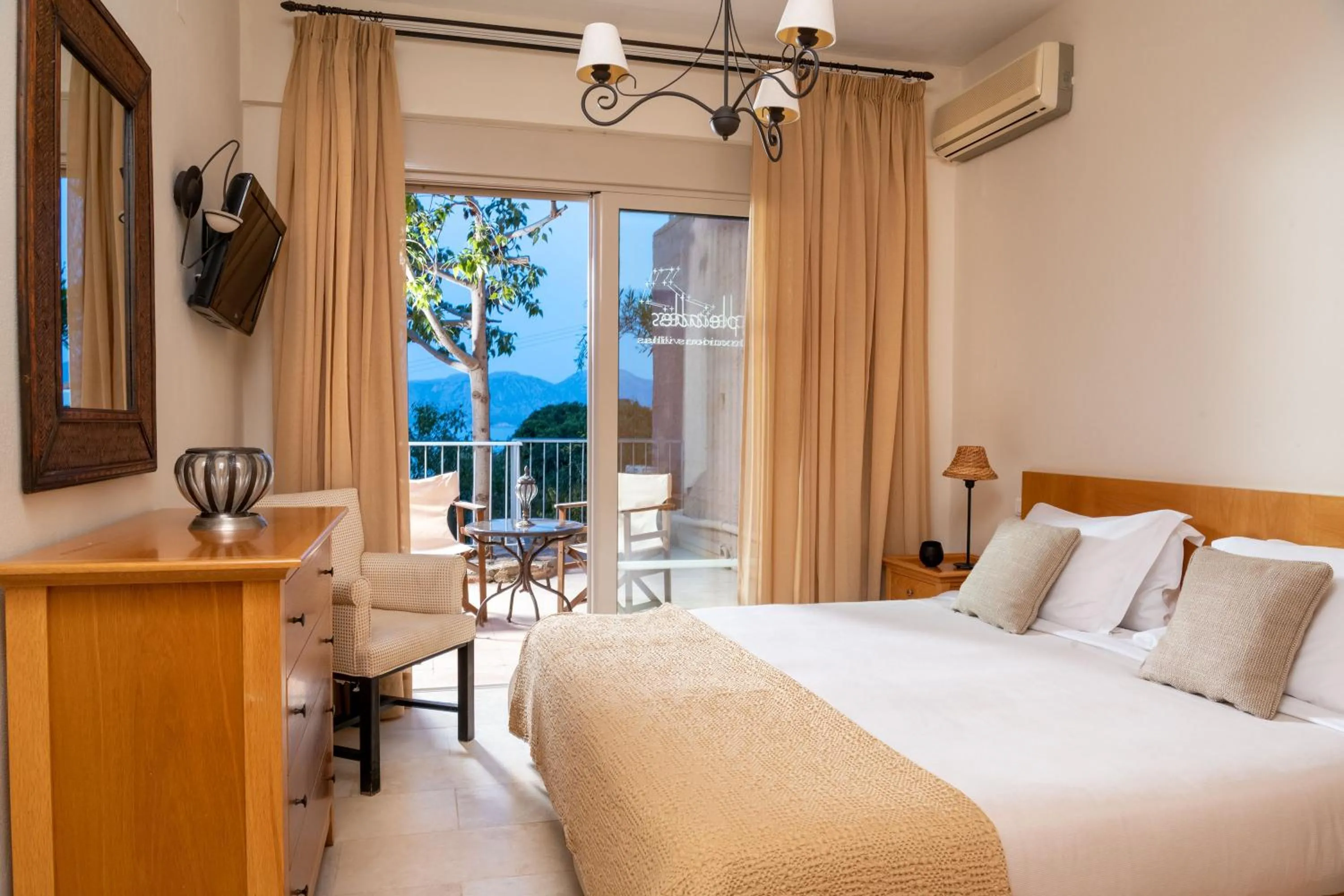 Bed in Pleiades Luxurious Villas