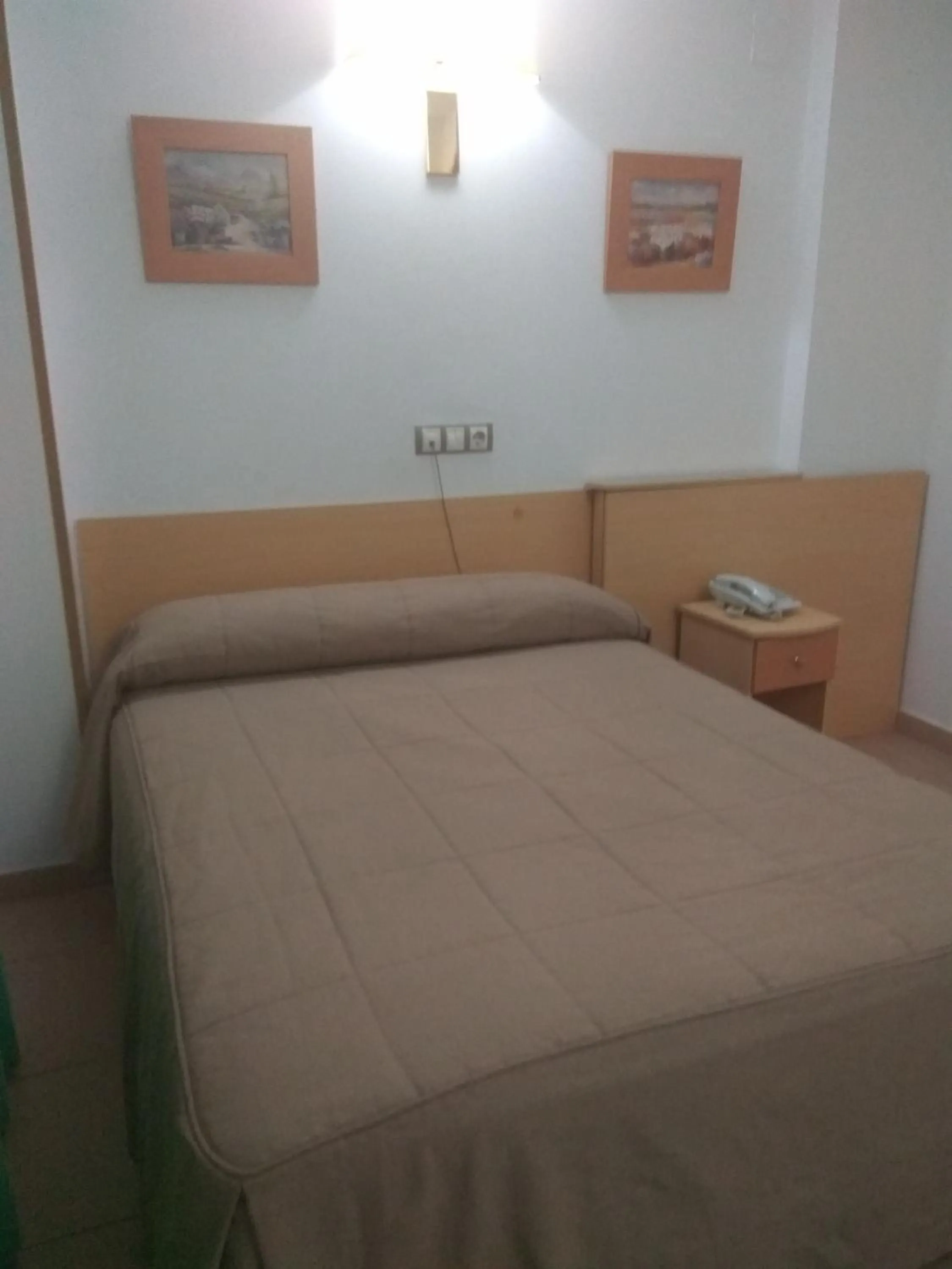 Bed in Hostal El Arco