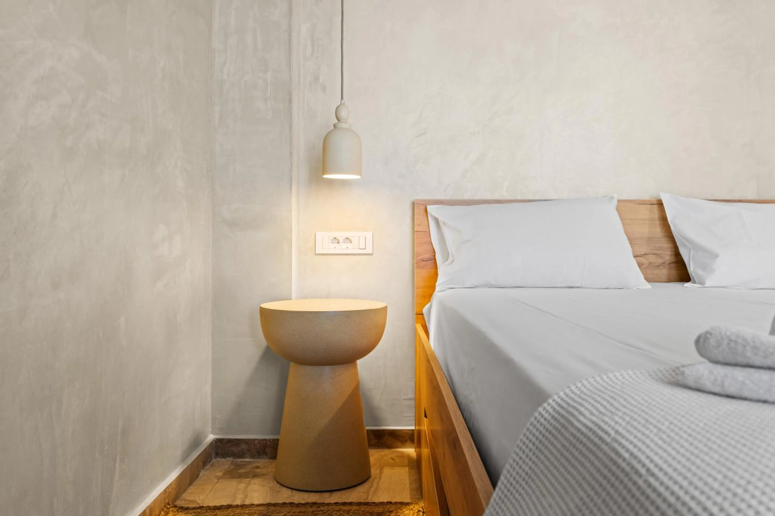 Bed in Nikos Apartments