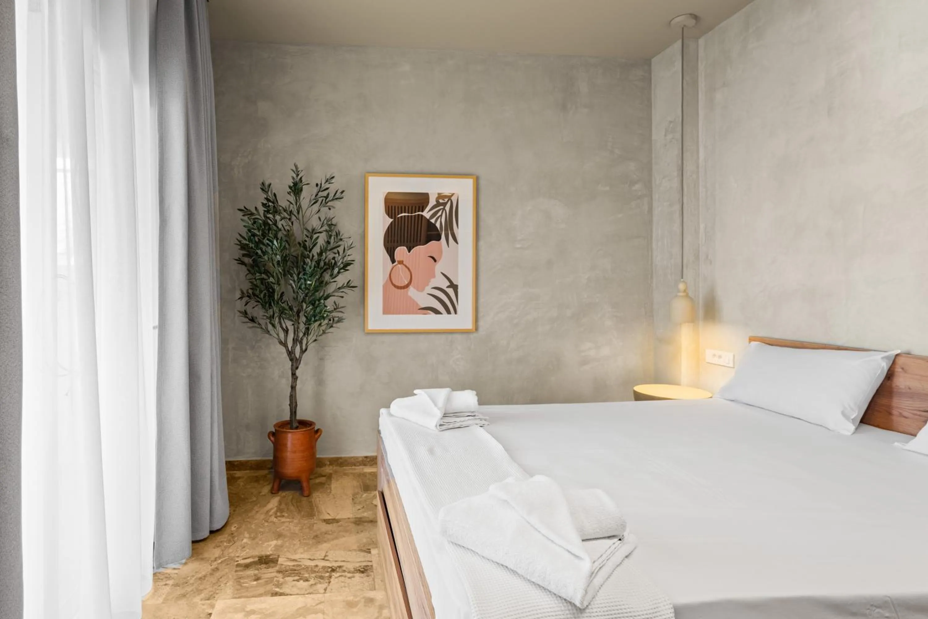 Bed in Nikos Apartments