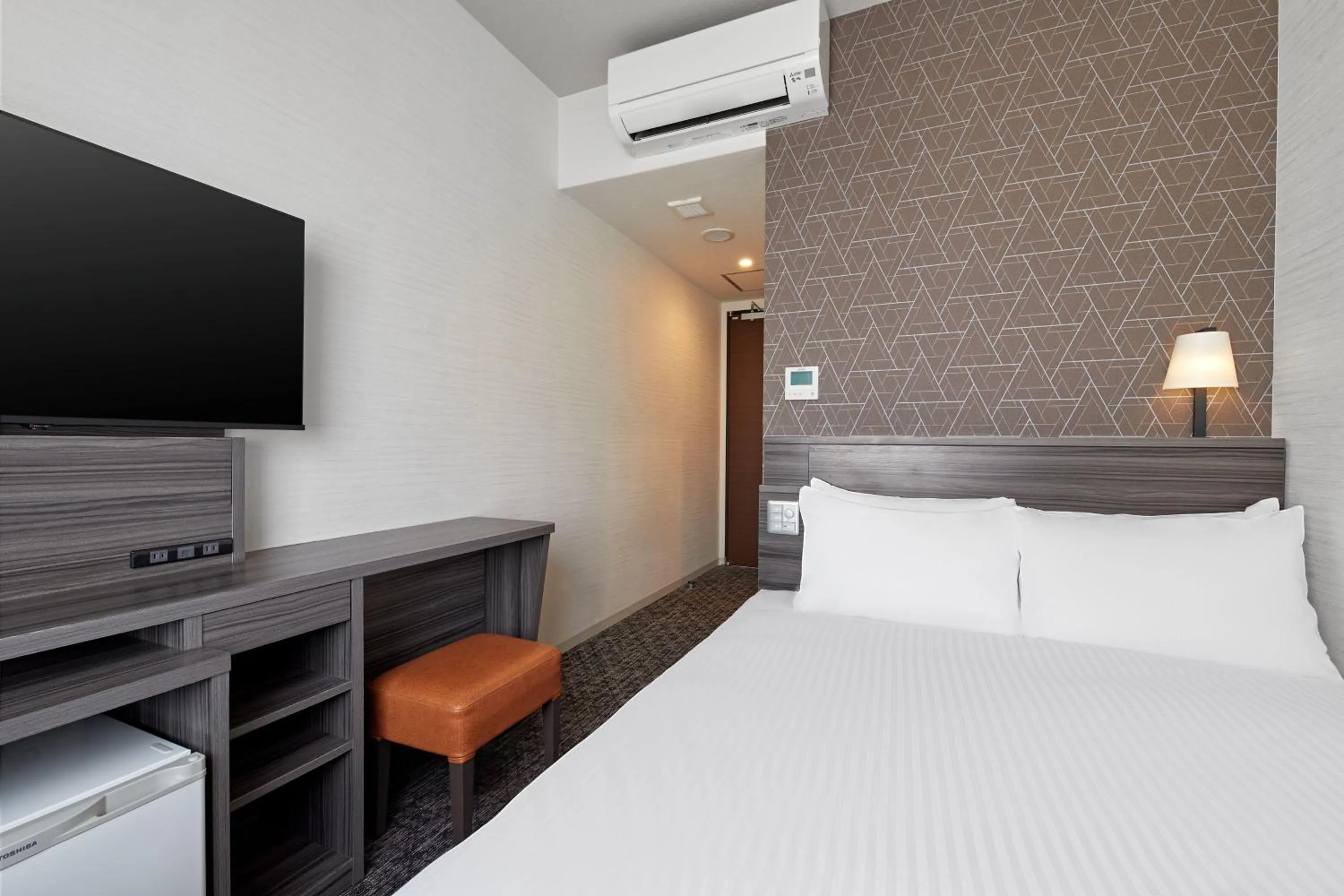 Bed in Sotetsu Fresa Inn Osaka Shinsaibashi