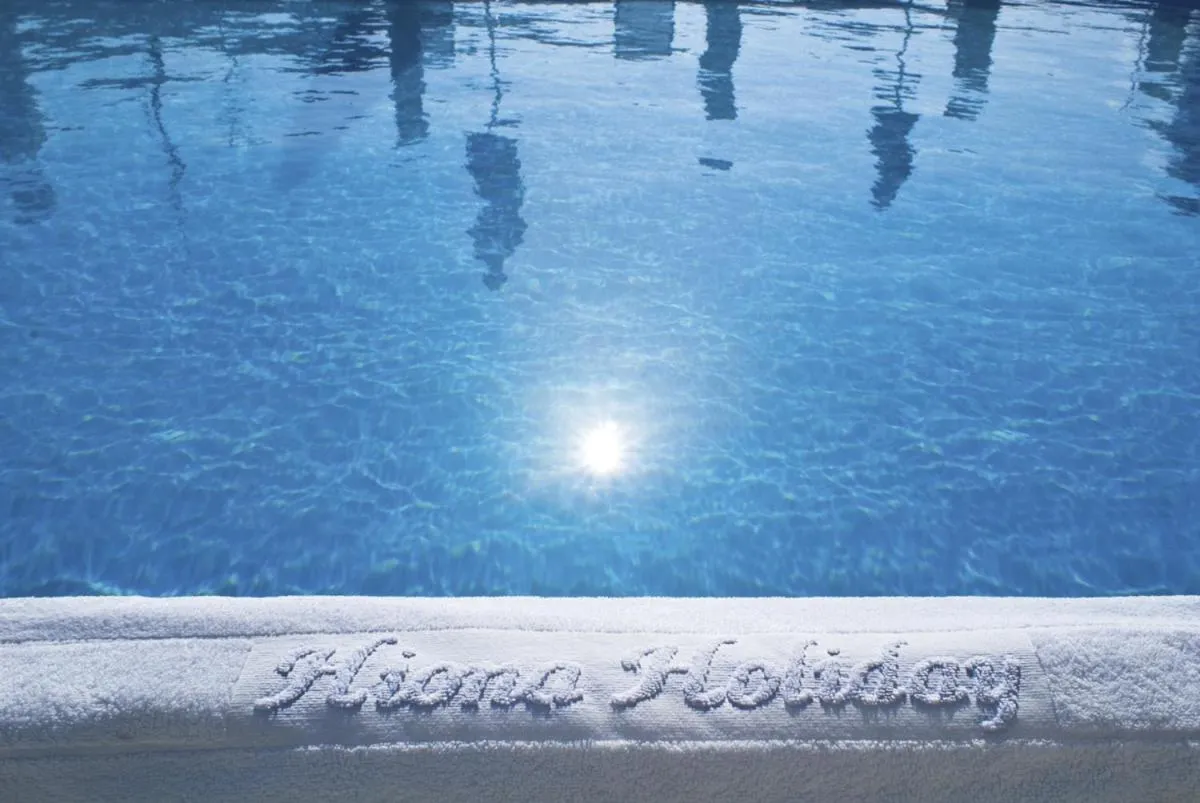 Property logo or sign in Hiona Holiday Hotel