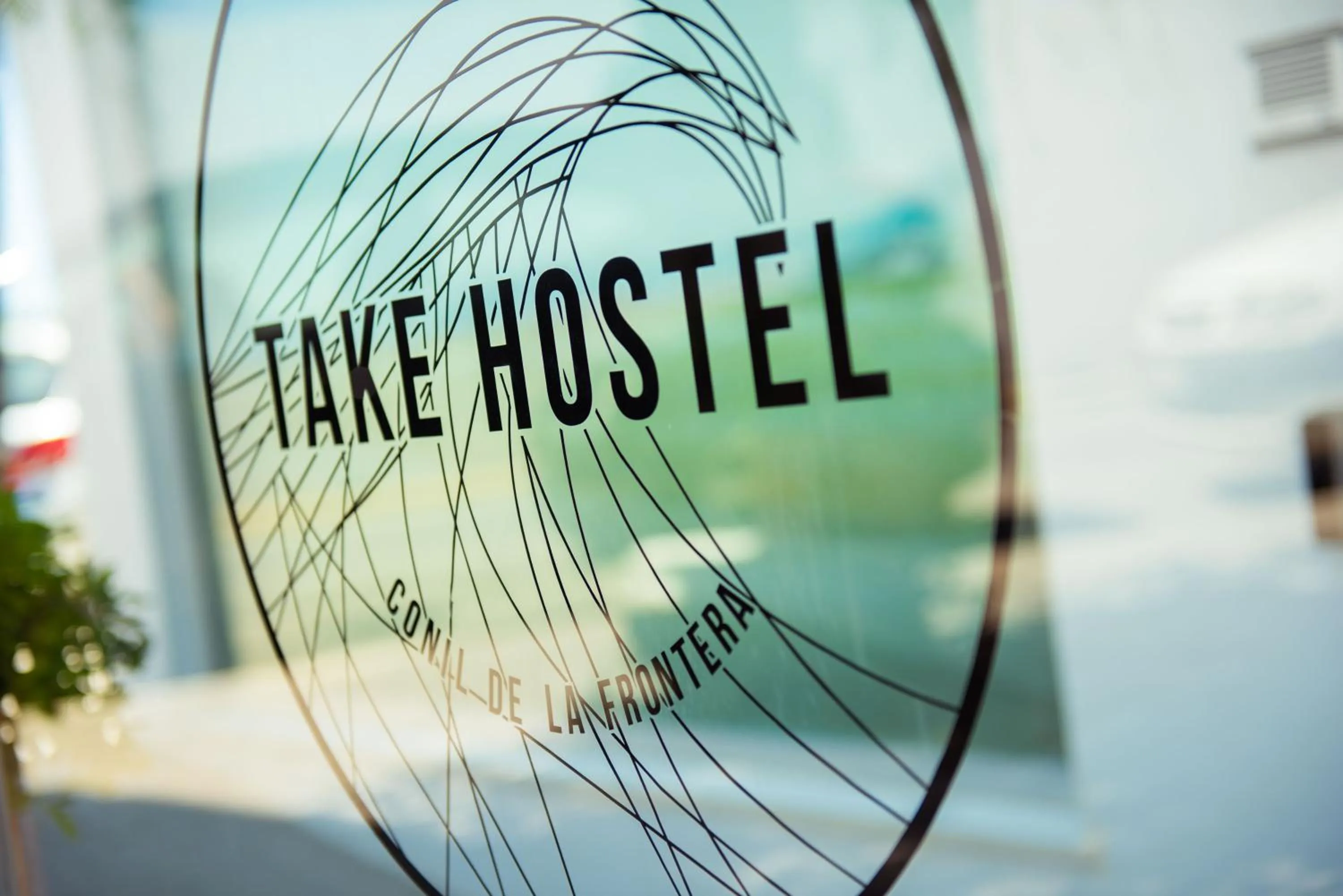 Property logo or sign in TAKE SURF Hostel Conil