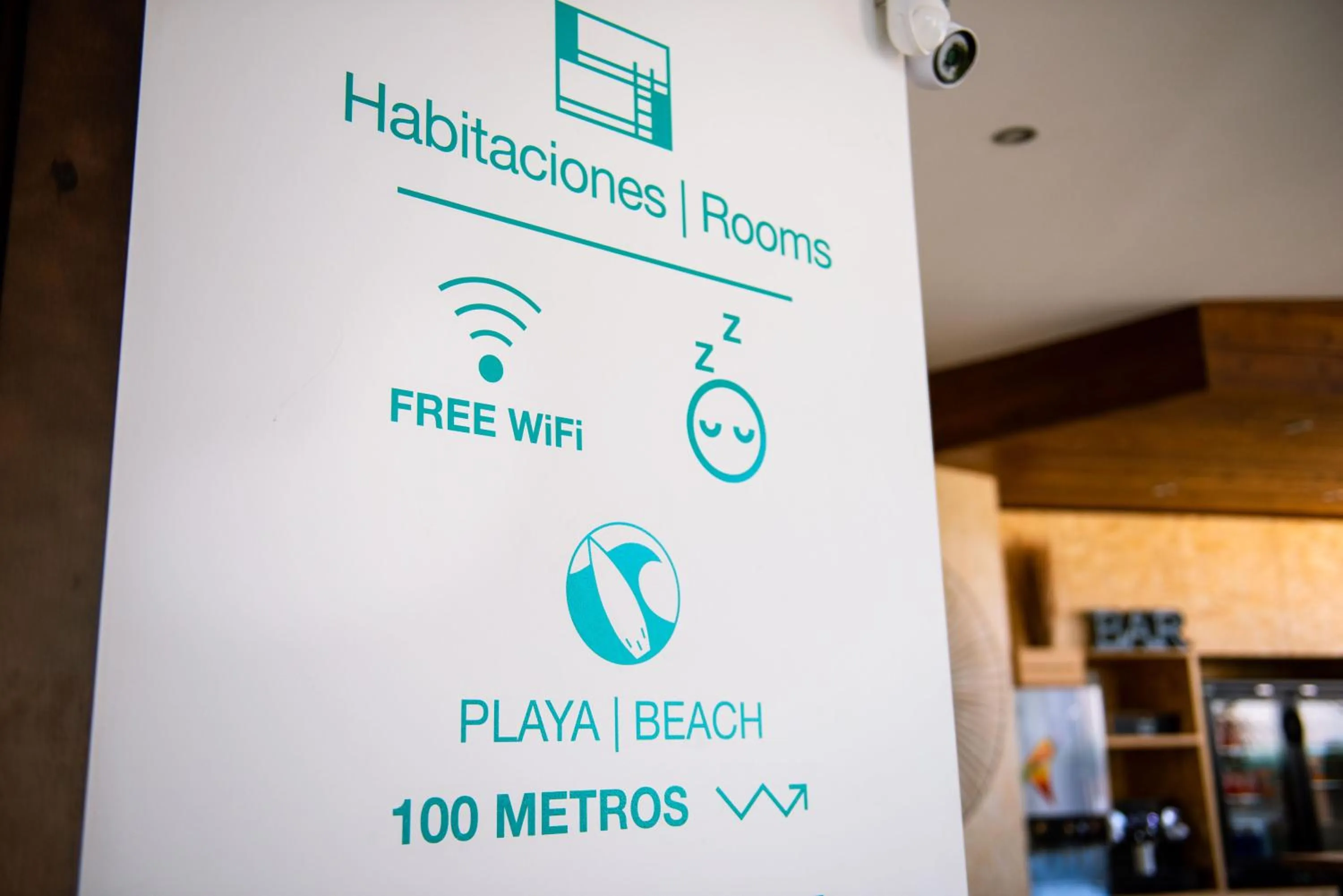 Text overlay in TAKE SURF Hostel Conil