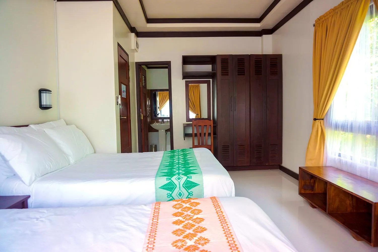 Bed in Veranda Suites and Restaurant