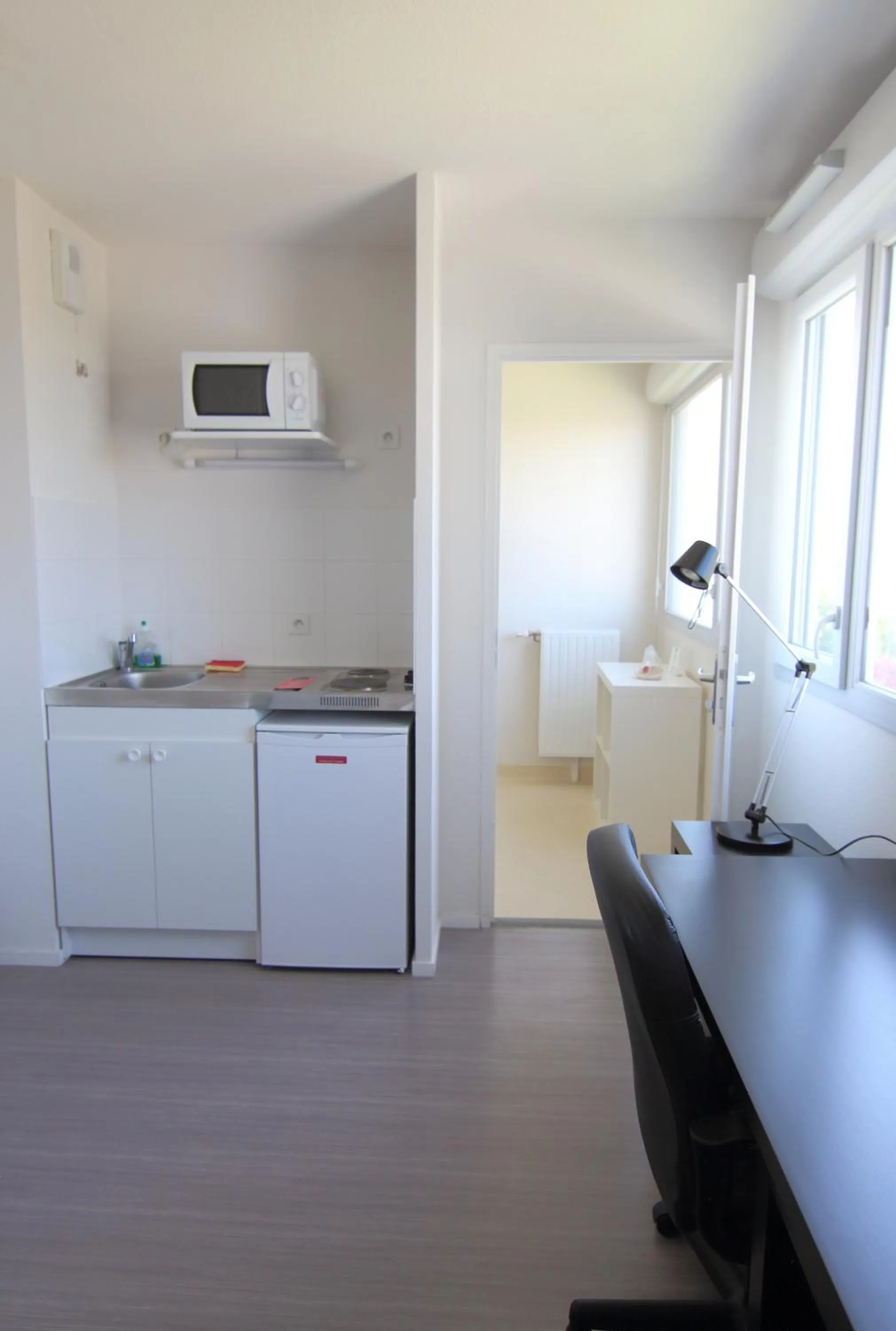 Kitchen or kitchenette in Résidence Hôtelière Laudine