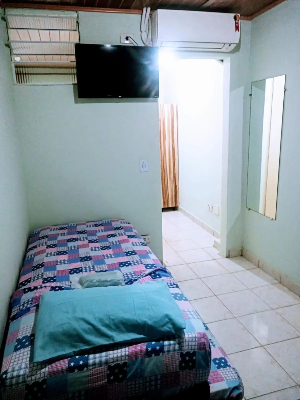 Bed in Pousada Reis Guarujá