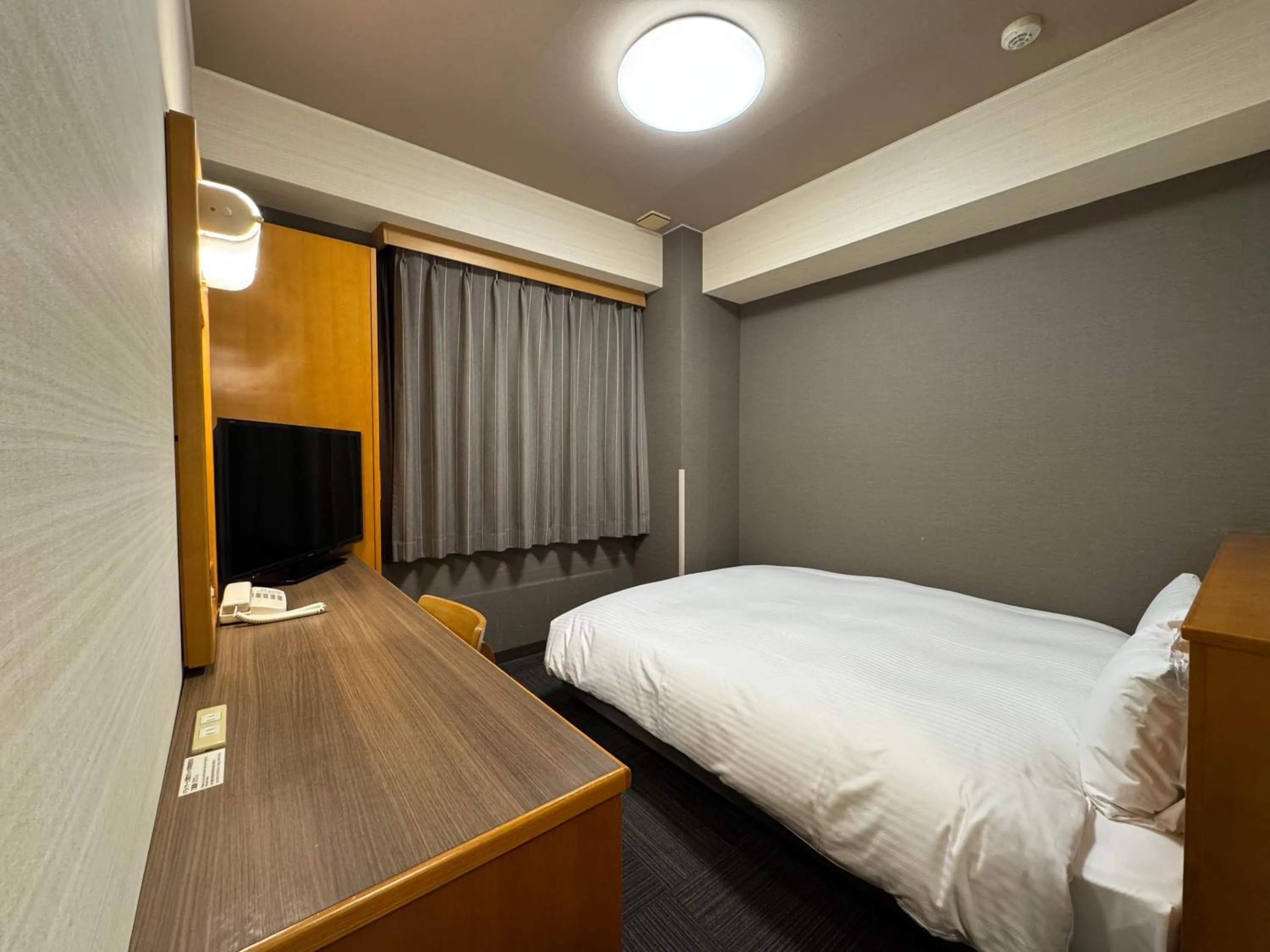 Photo of the whole room, Bed in Hotel Route-Inn Nakatsugawa Inter