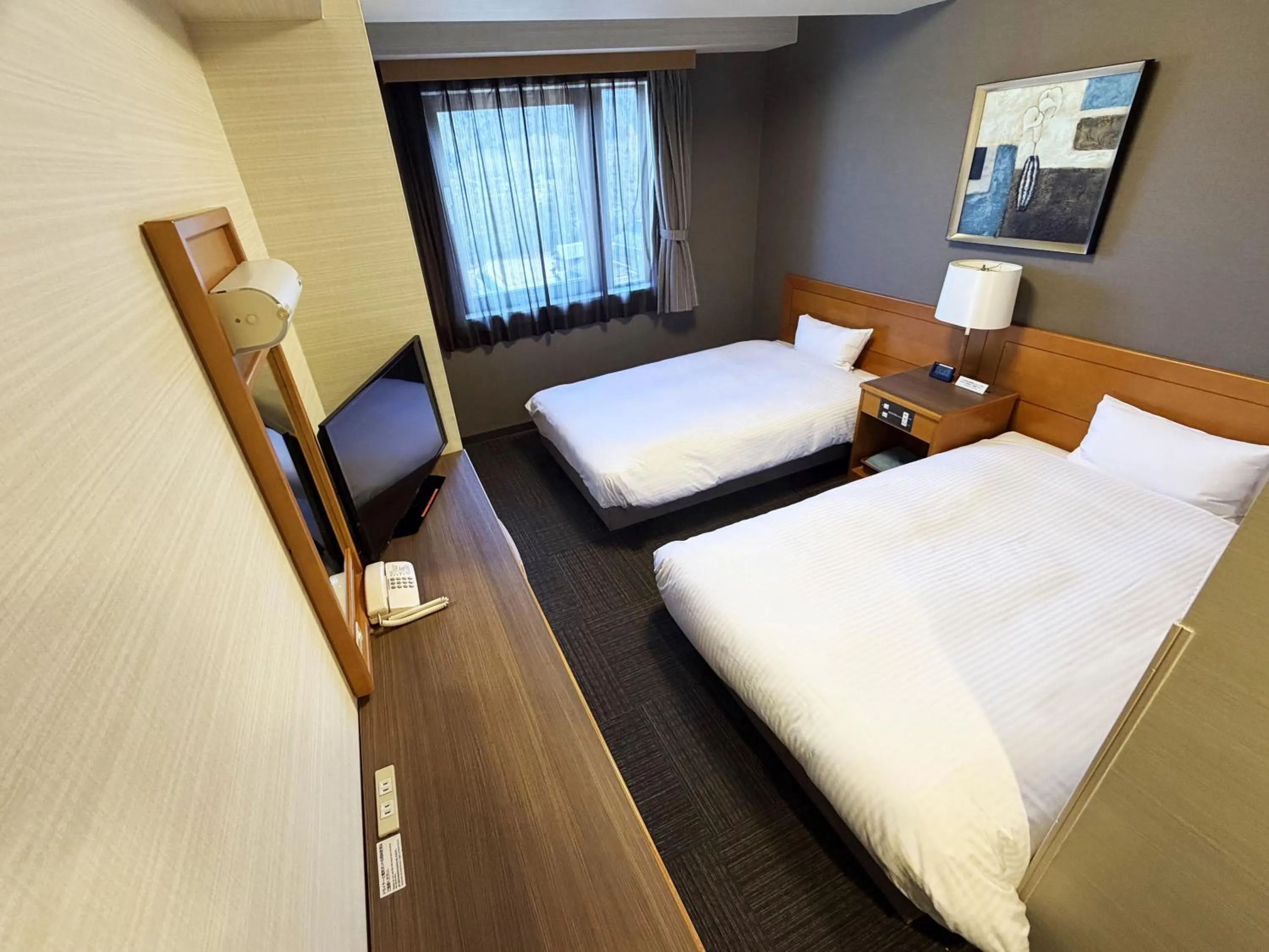 Photo of the whole room, Bed in Hotel Route-Inn Nakatsugawa Inter